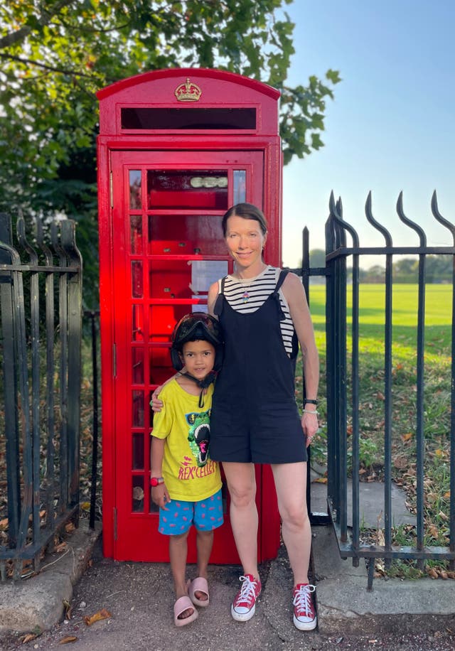 Neo and Skye next to the same telephone box she used when she lived in England as a teenager