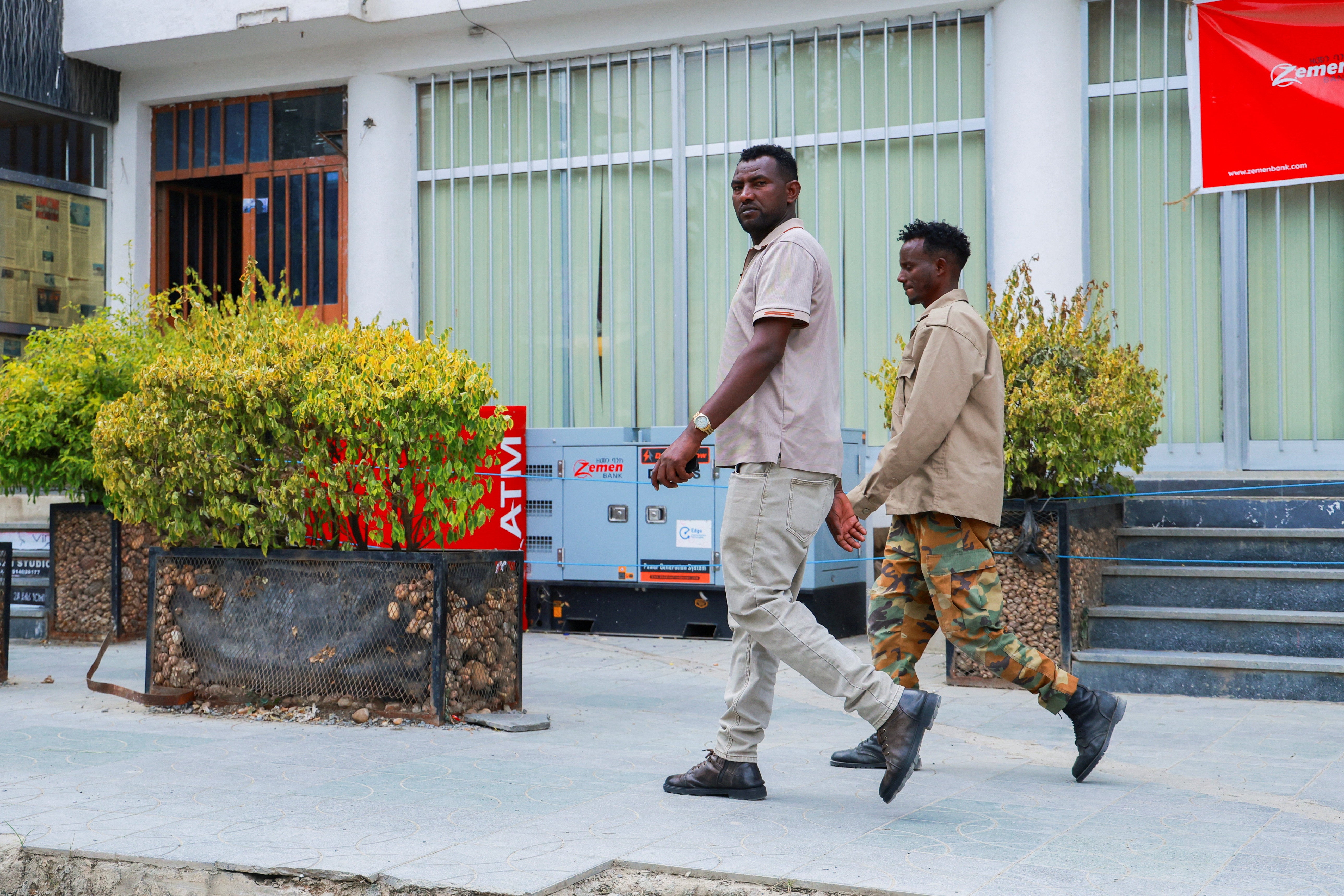 Members of Tigrayan forces patrol along a street (Reuters)