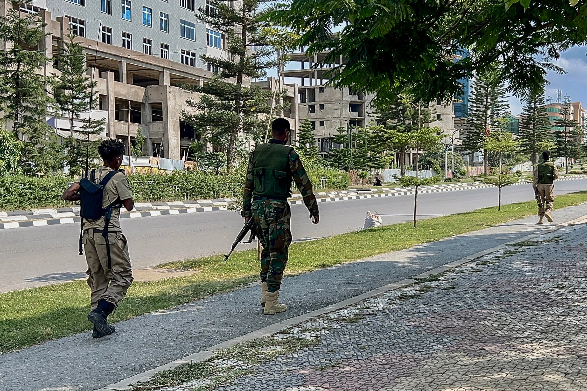 Members of the Tigray People's Liberation Front (TPLF) walk along a main road in Mekelle on September 23, 2026