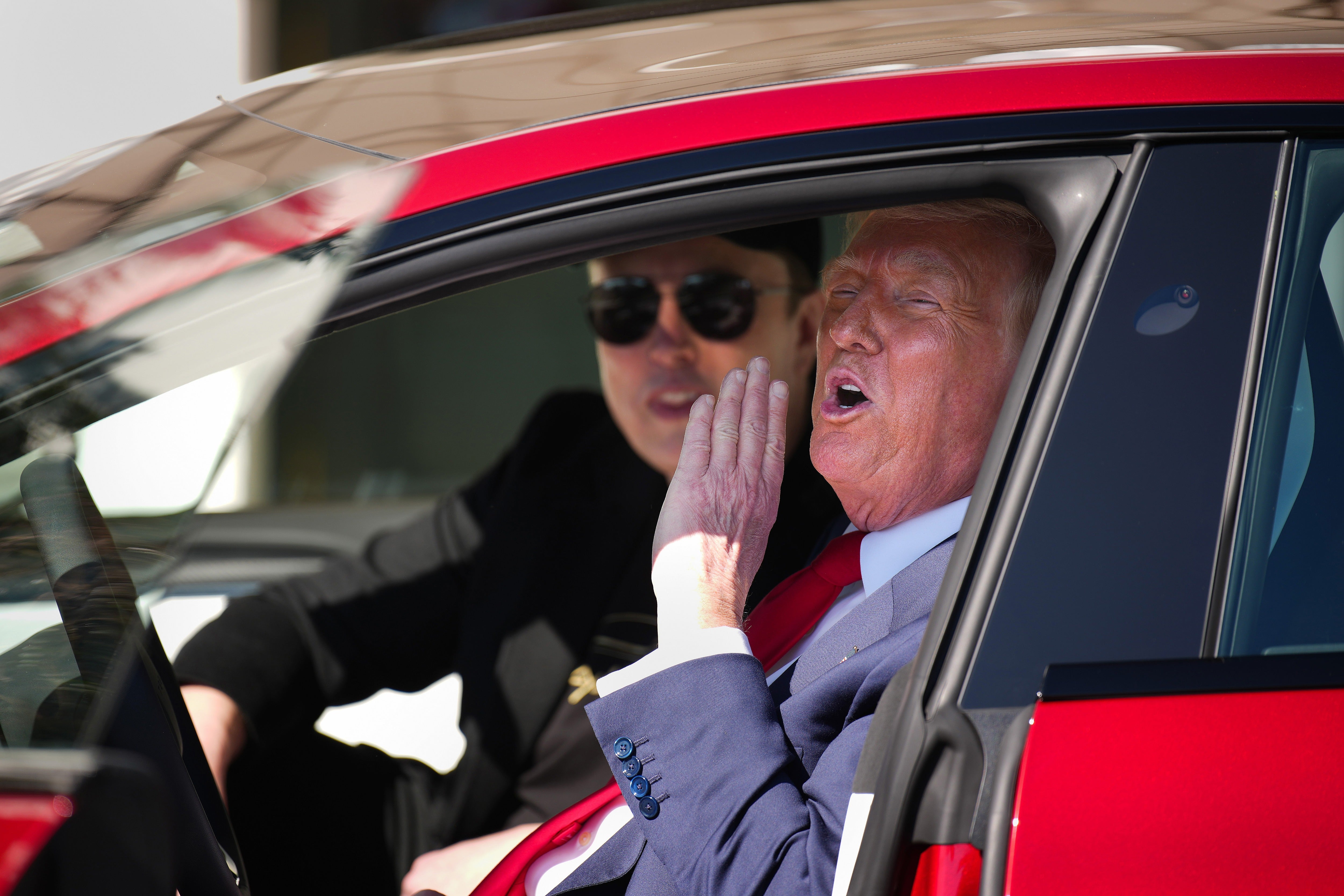 Tesla CEO Elon Musk and President Donald Trump in a Tesla Model S, the same vehicle type that exploded and destroyed a Tampa Bay home, allegedly due to faulty batteries that can catch fire when exposed to saltwater (Getty Images)