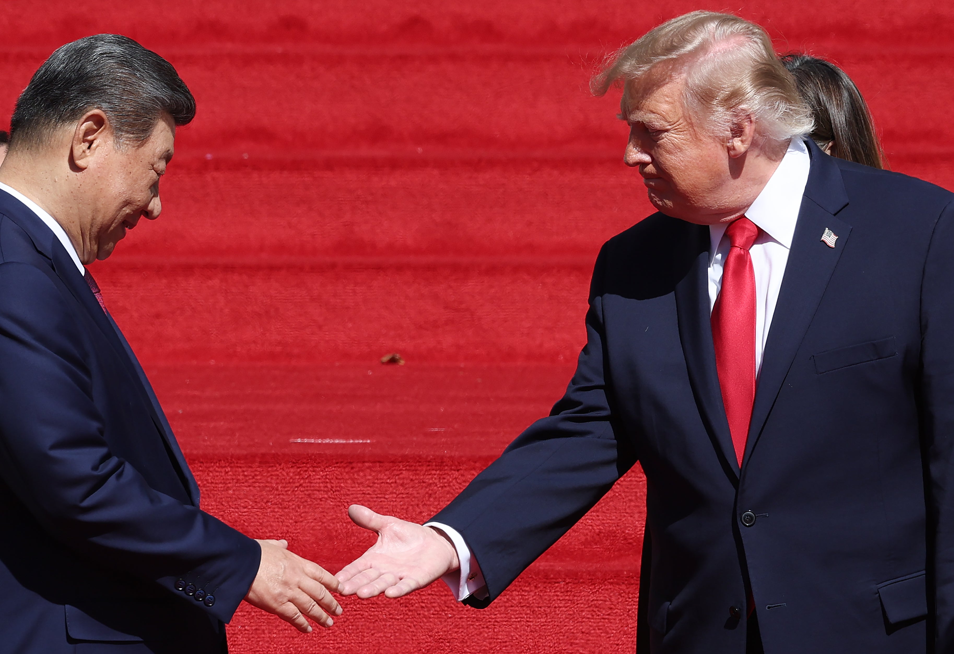 President Donald Trump (R) shakes hands with President of China Xi Jinping as they depart the National Archives Museum following a tour on September 25, 2026 in Washington, DC.
