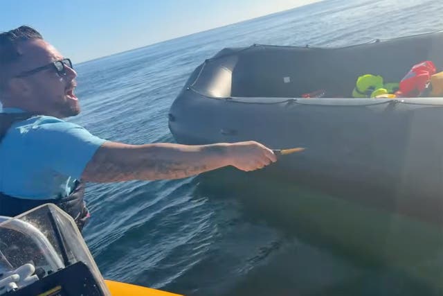 Tommo had been filmed appearing to slash the side of a dinghy in the English Channel with a rescue crew member still on board