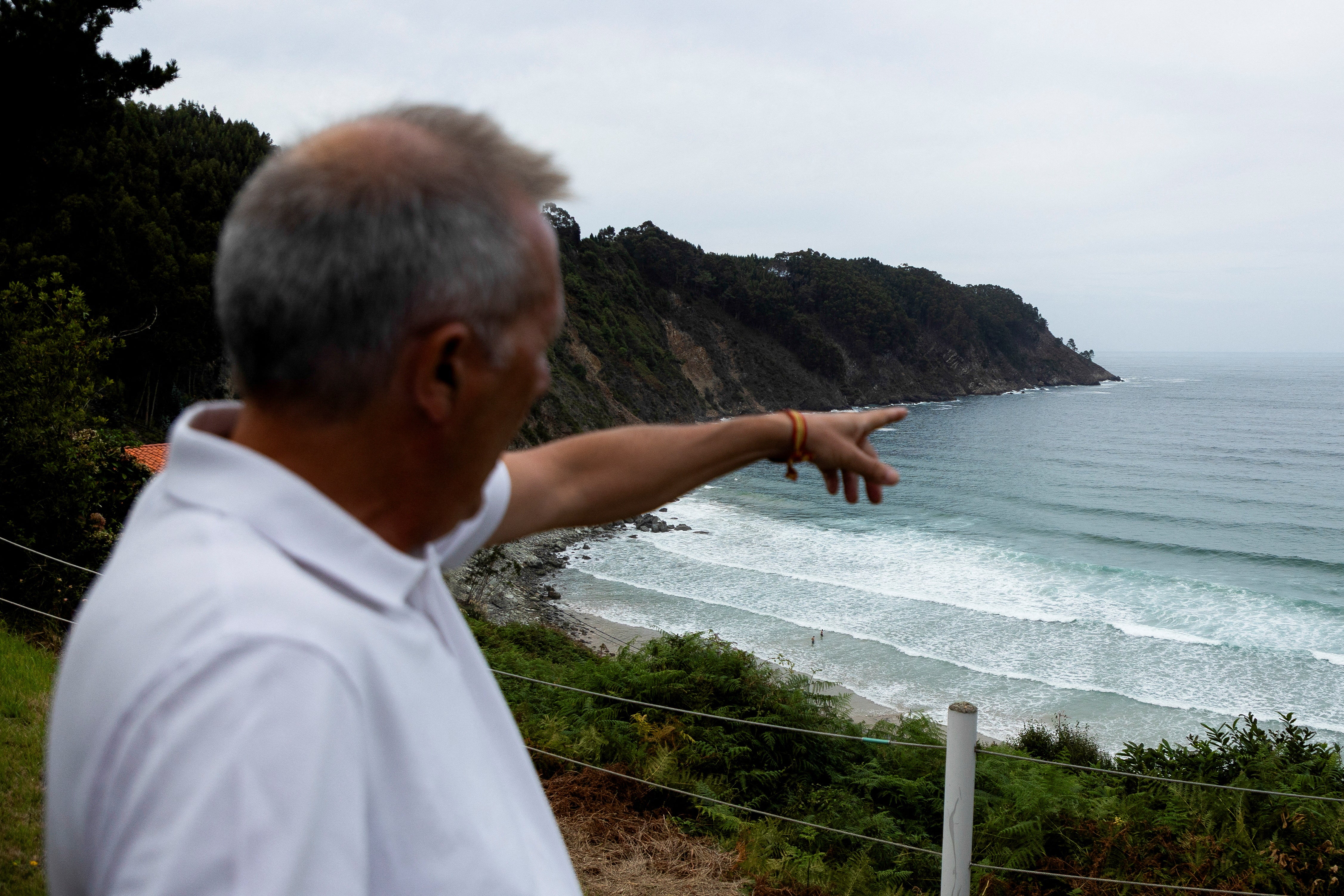 Jose Manuel Rico Ordas, a marine ecology professor at the University of Oviedo and co-director of its climate change chair, stands along the coast of Lamuno, Asturias, in northern Spain