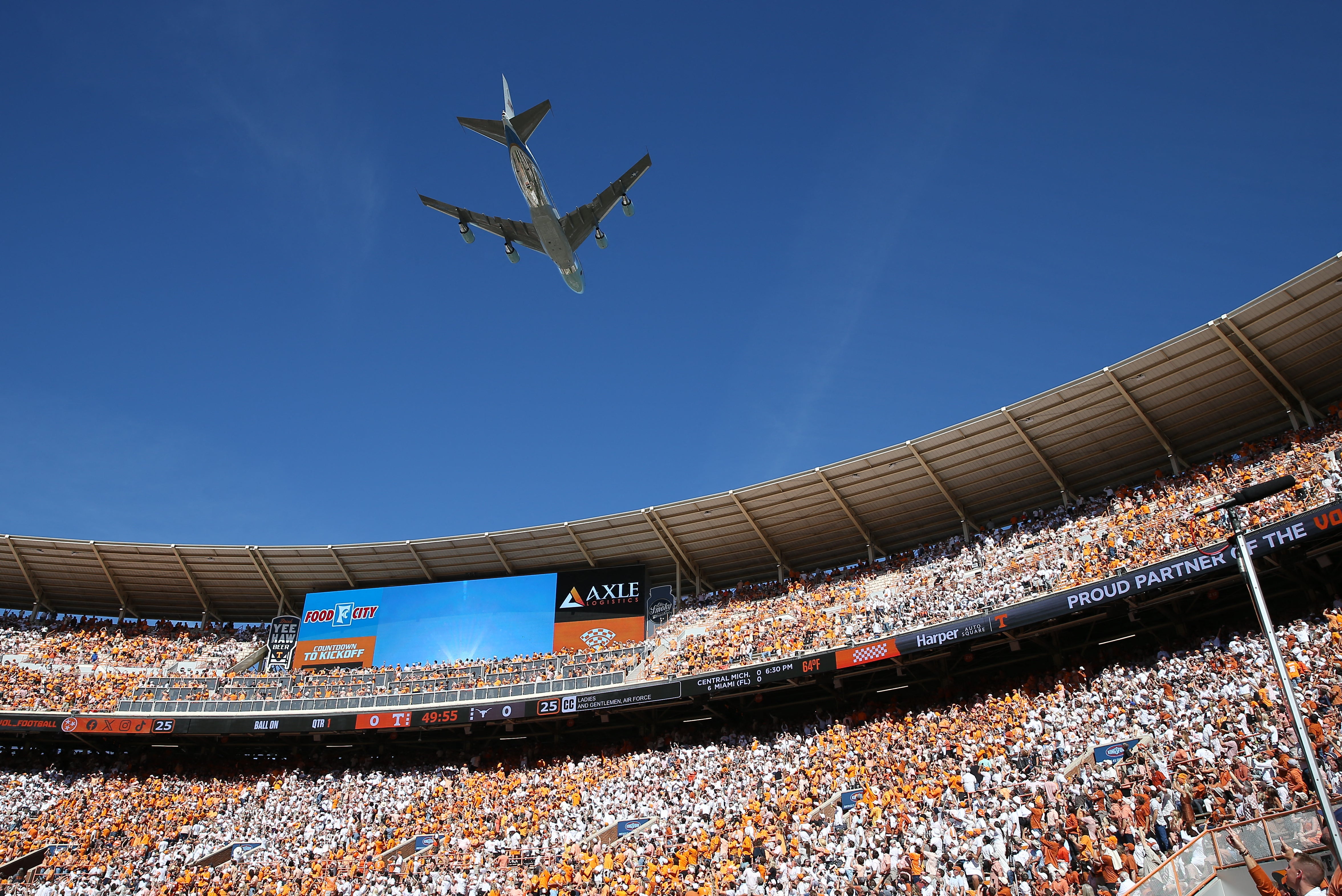 Air Force One flies over Neyland Stadium before the game between Texas Longhorns and Tennessee Volunteers