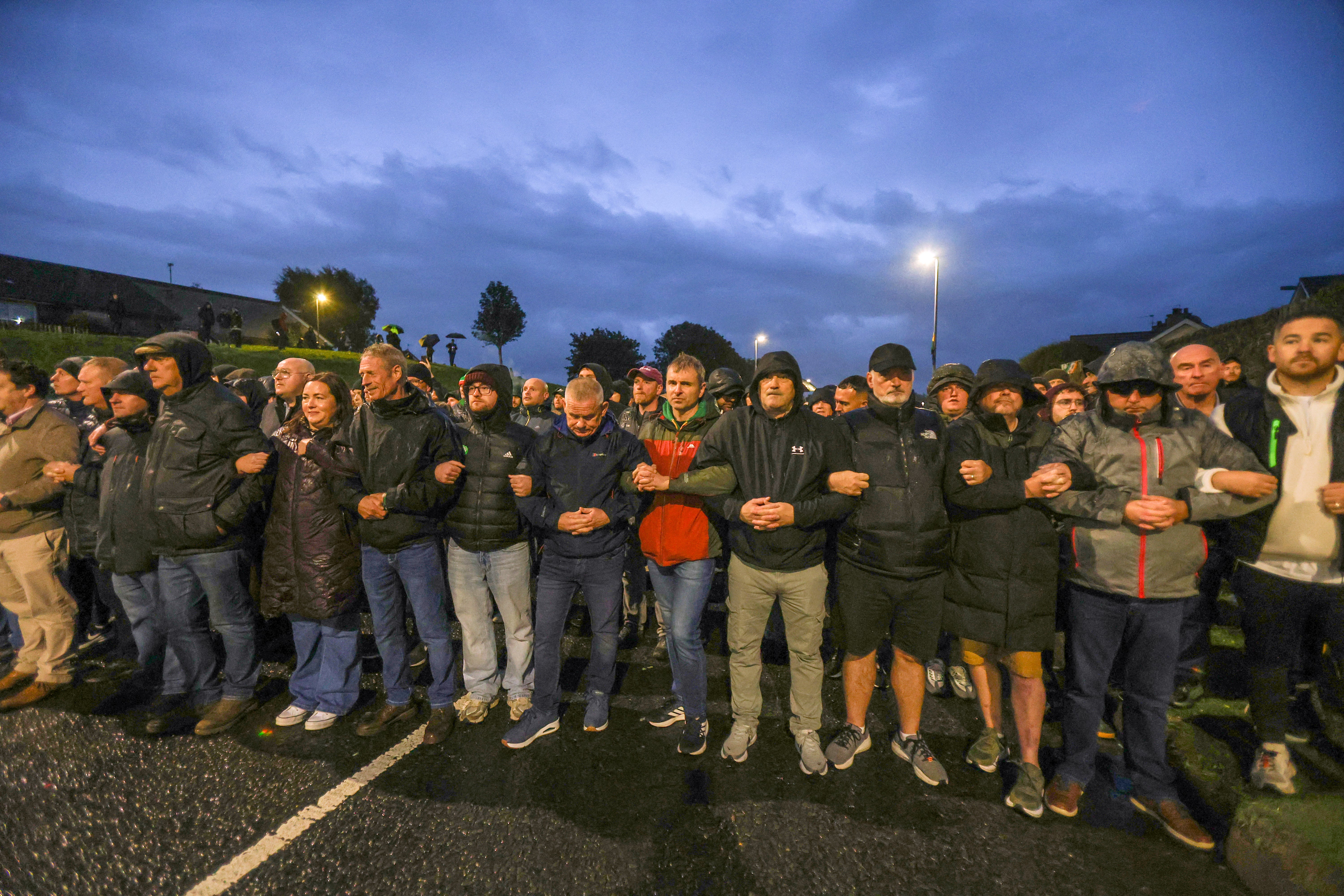 Protesters block the Garvaghy Road in Portadown, to prevent a parade of marchers from the Orange Order using the route through the mainly nationalist area of the town