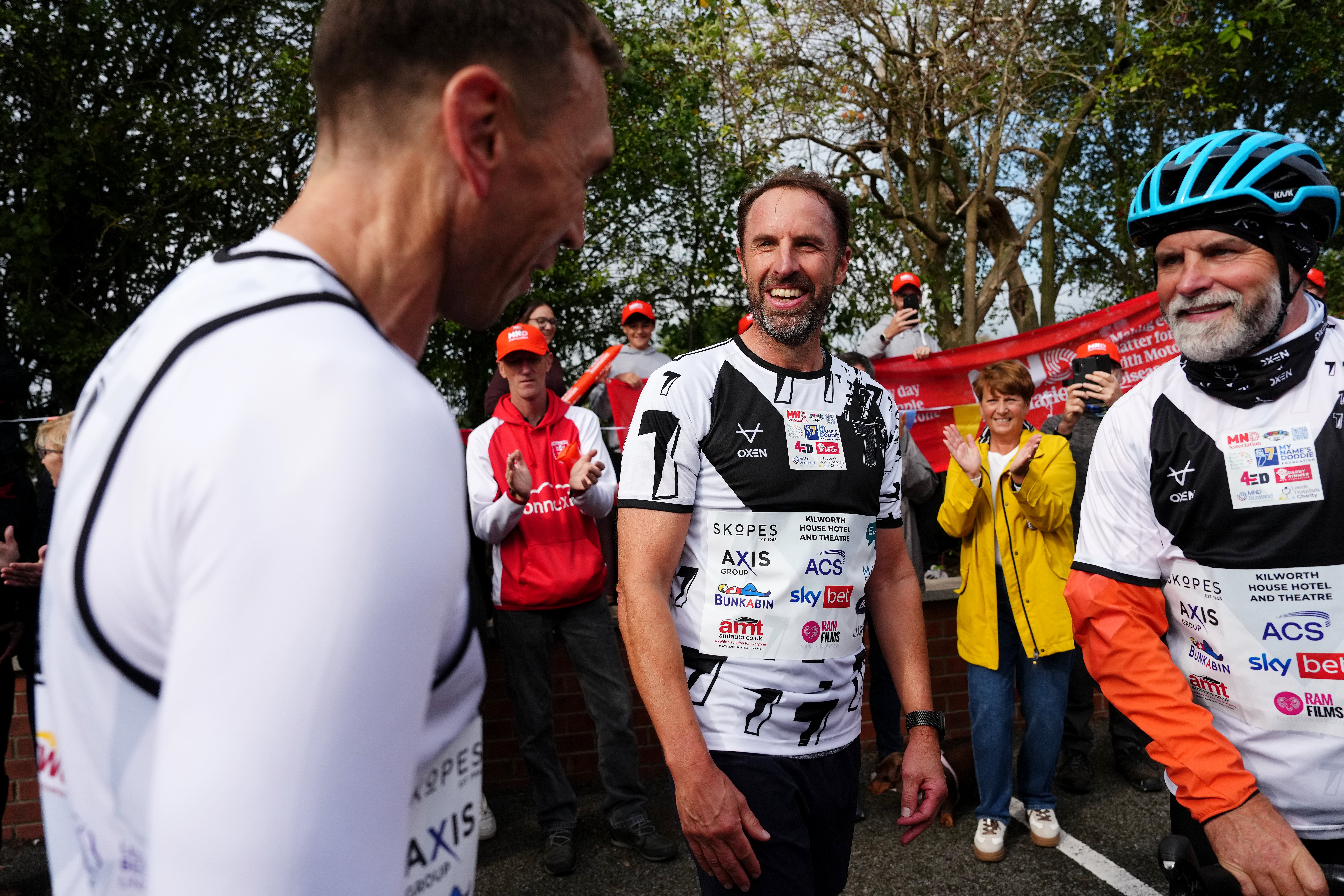 Sir Gareth Southgate (centre) also ran the final stage towards Shiptonthorpe Village Hall (Martin Rickett/PA)