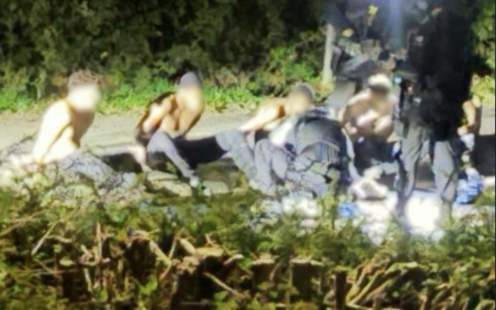 An image sent to BBC showing the moment five men were arrested near RAF Fairford
