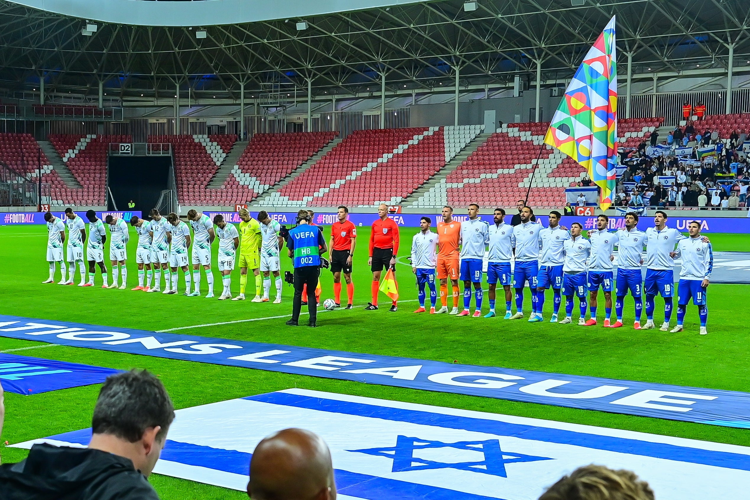 Ireland players bow their head during Israel national anthem