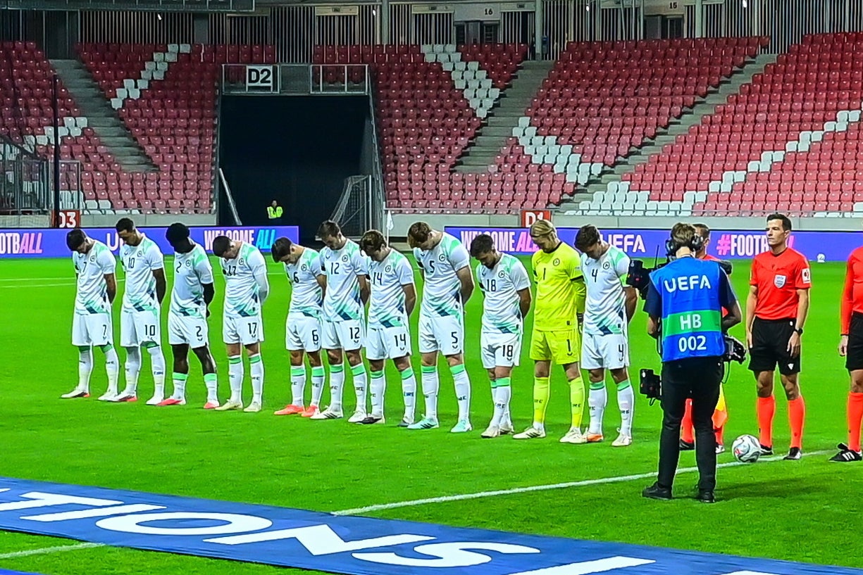 Ireland players bow their head during Israel national anthem (AP)