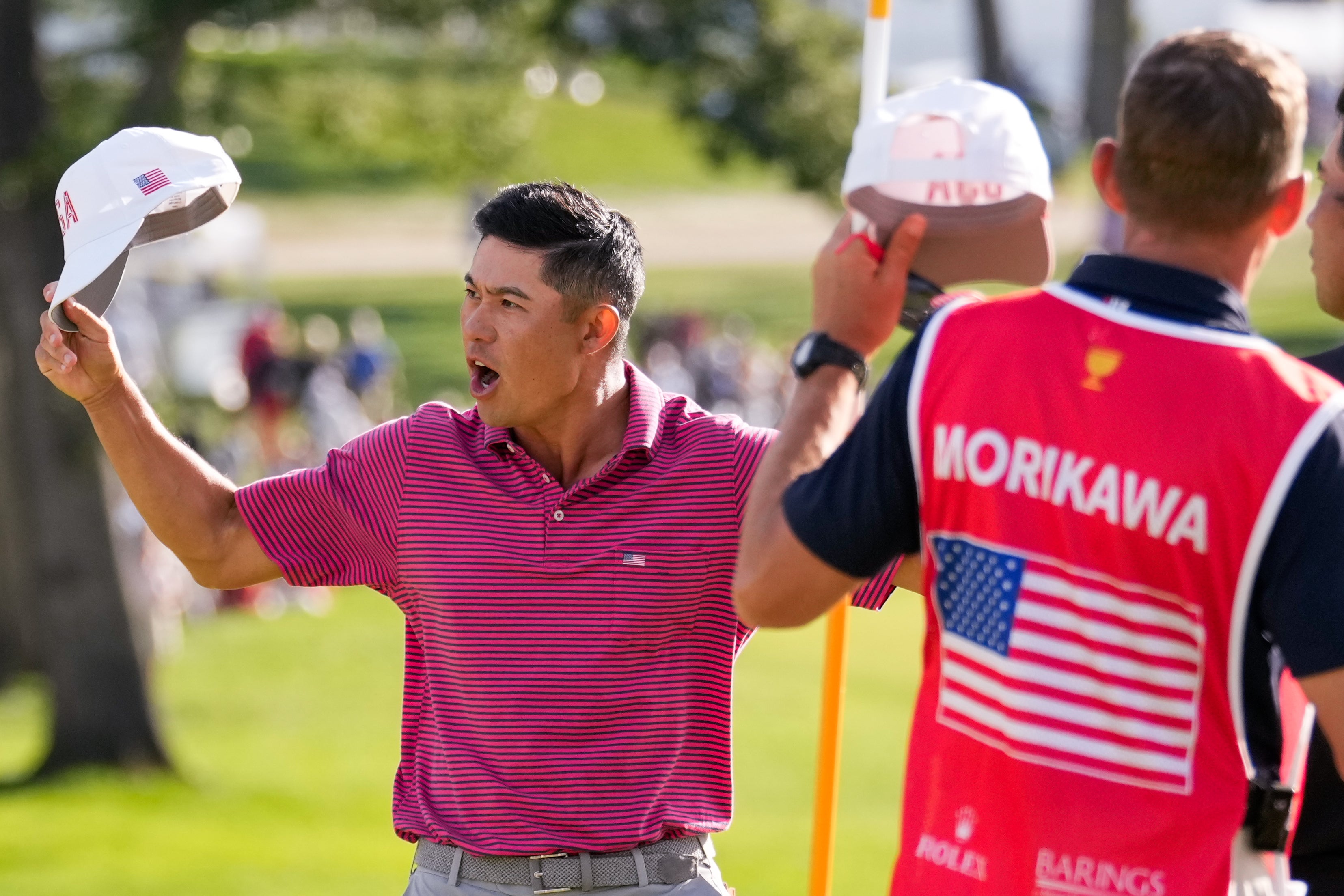 USA teams' Collin Morikawa celebrates his win over International teams' Hideki Matsuyama (AP)