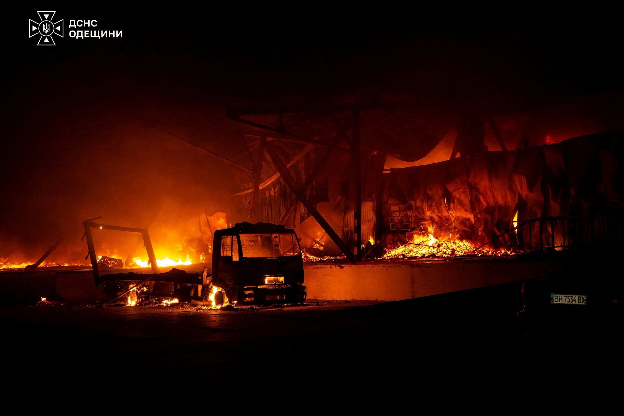 A truck burns at the site of a sorting terminal of the Nova Post delivery company which was hit by a Russian drone strike