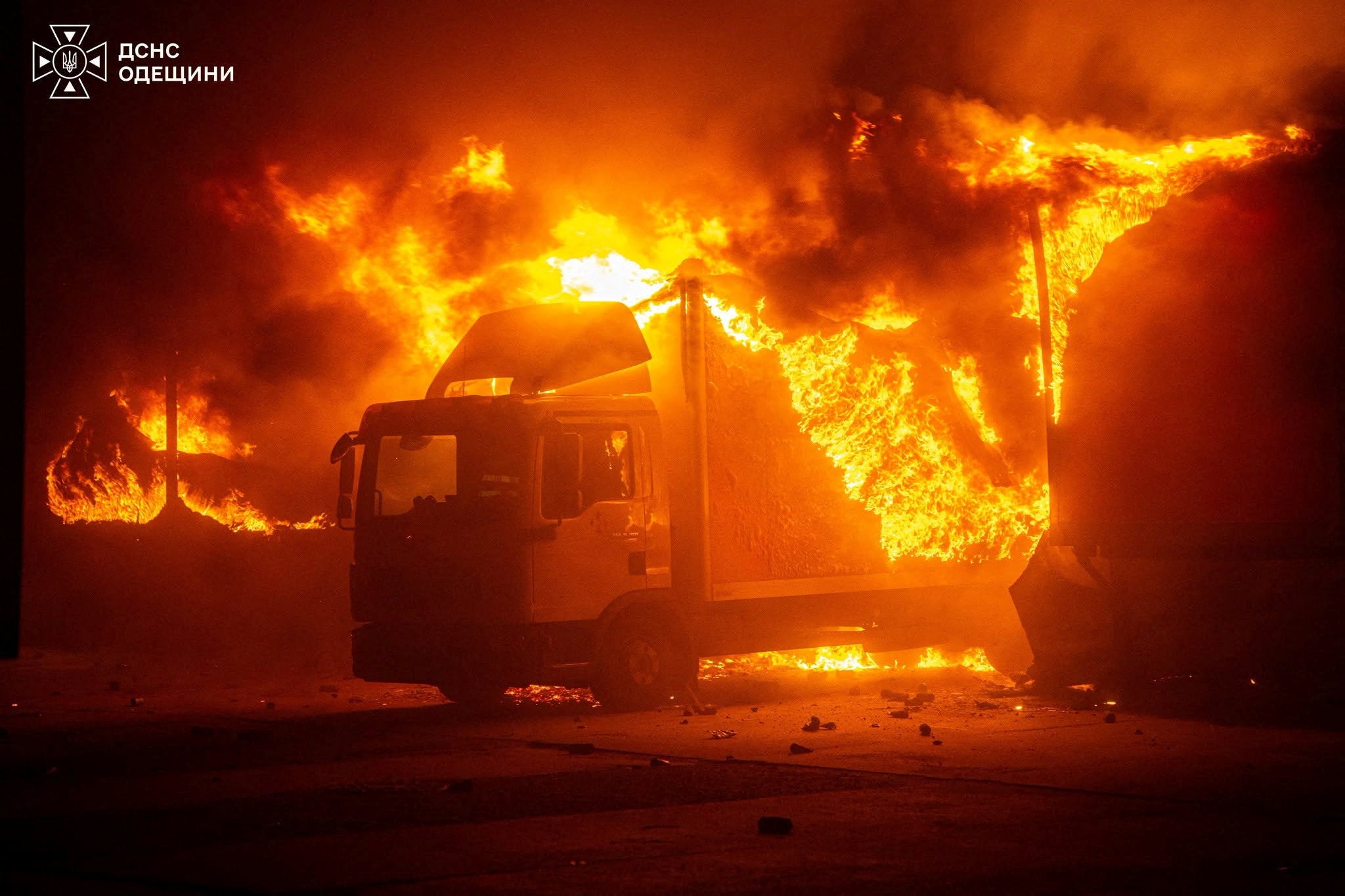 A truck burns at the site of a sorting terminal of the Nova Post delivery company which was hit by a Russian drone strike