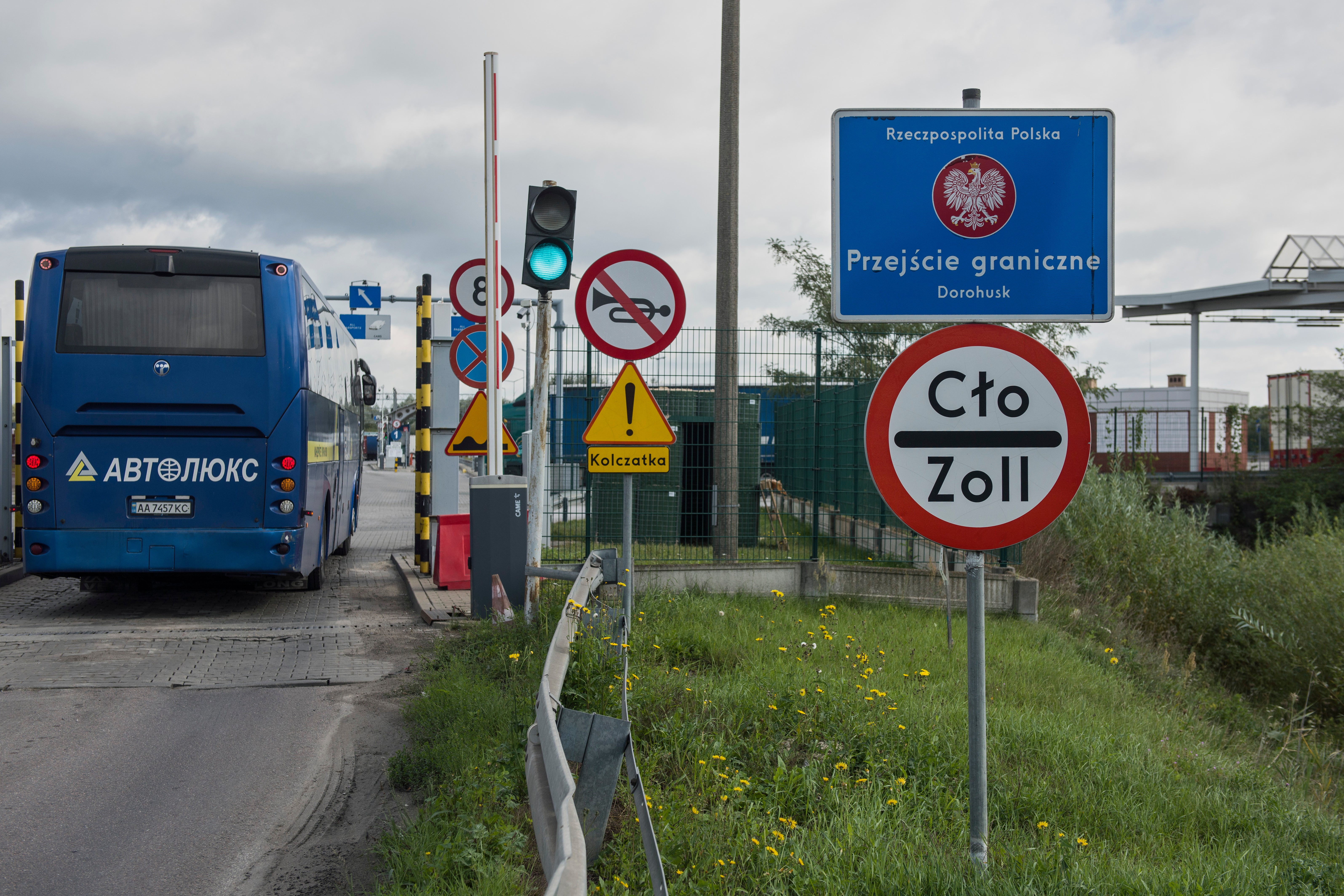 A bus drives past the security checkpoint at the Dorohusk-Jagodzin border crossing between Poland and Ukraine, Dorohusk, Poland, on Sept. 24, 2026. (AP Photo/Attila Husejnow)