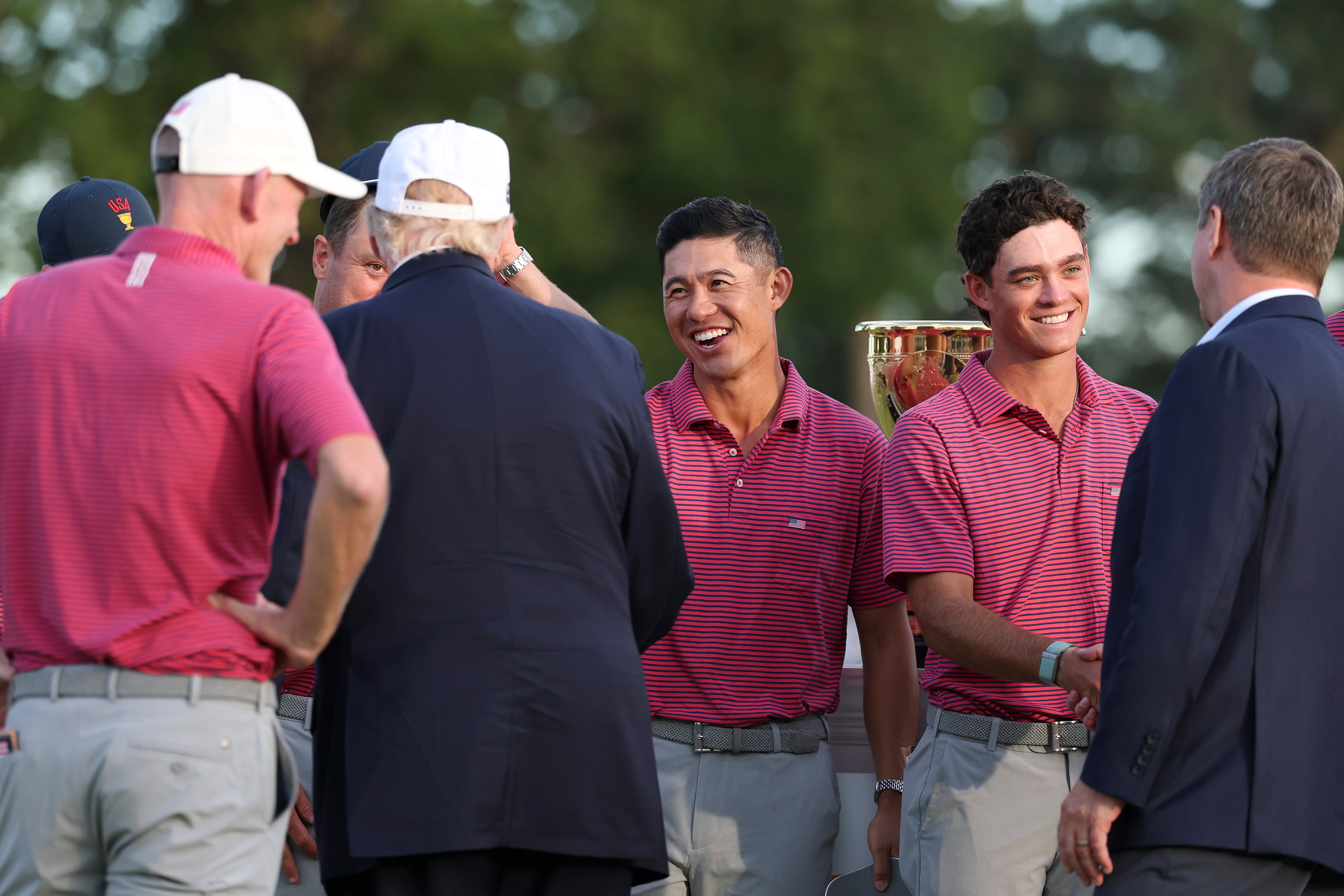 Cameras caught Trump joking around with victorious Team USA golfers on Sunday (Getty)
