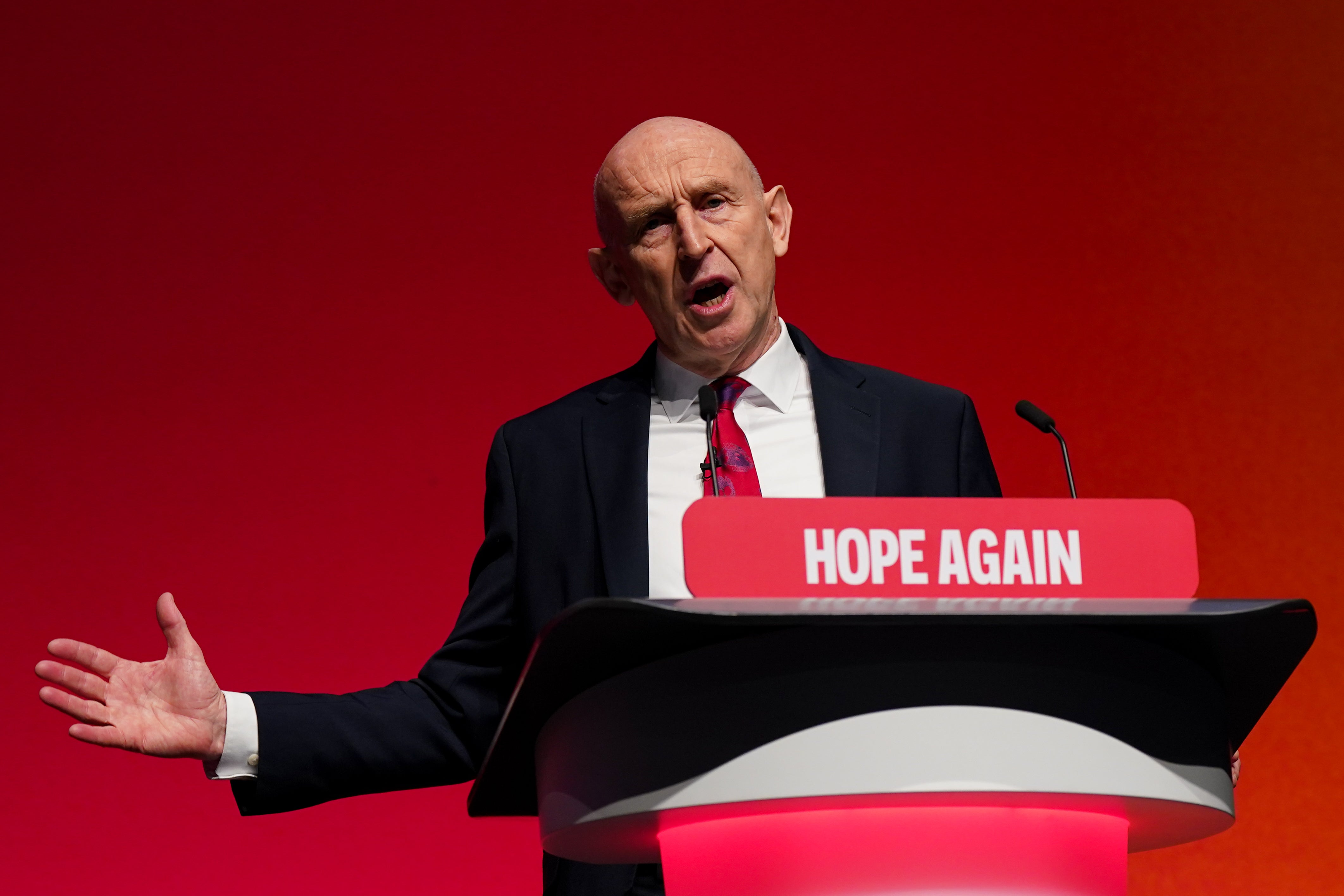 John Healey delivering his speech in Liverpool (Getty)