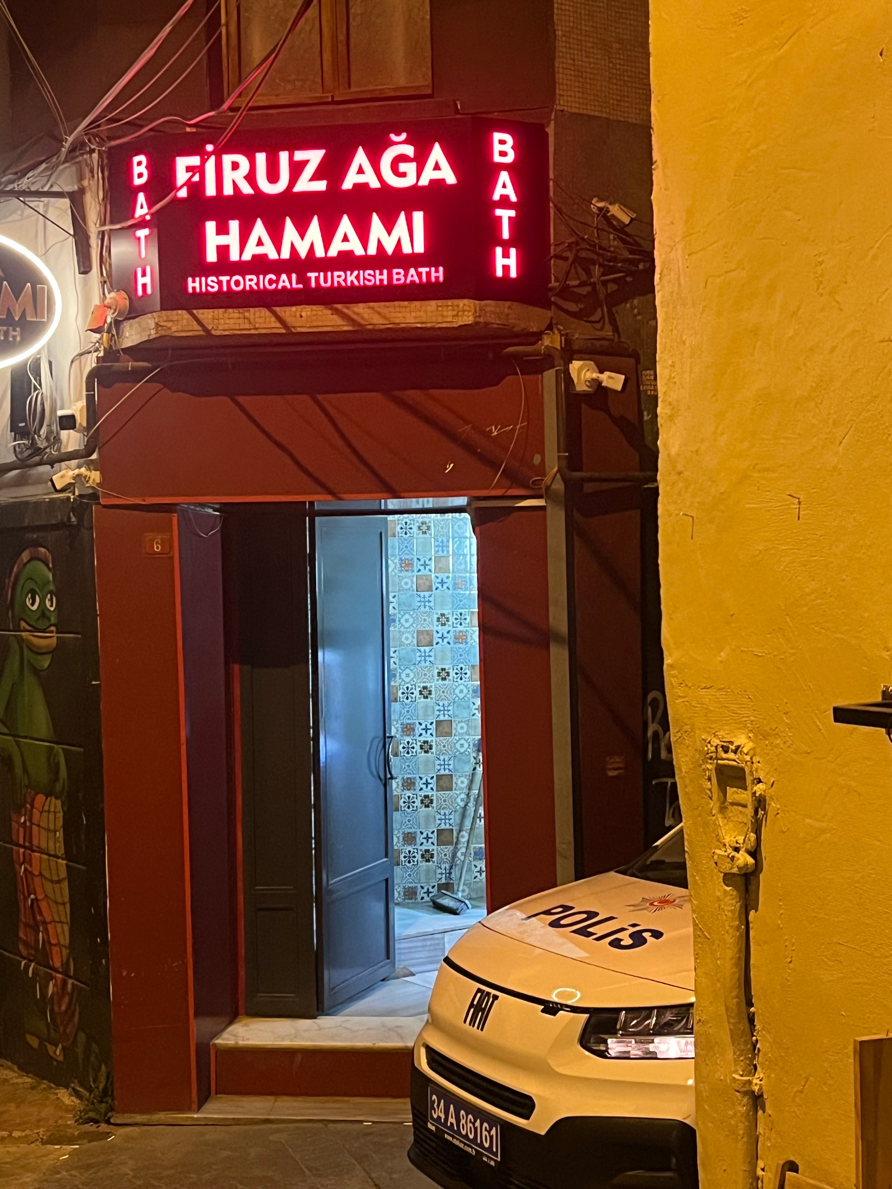 Police wait outside a ‘gay-friendly’ hamam