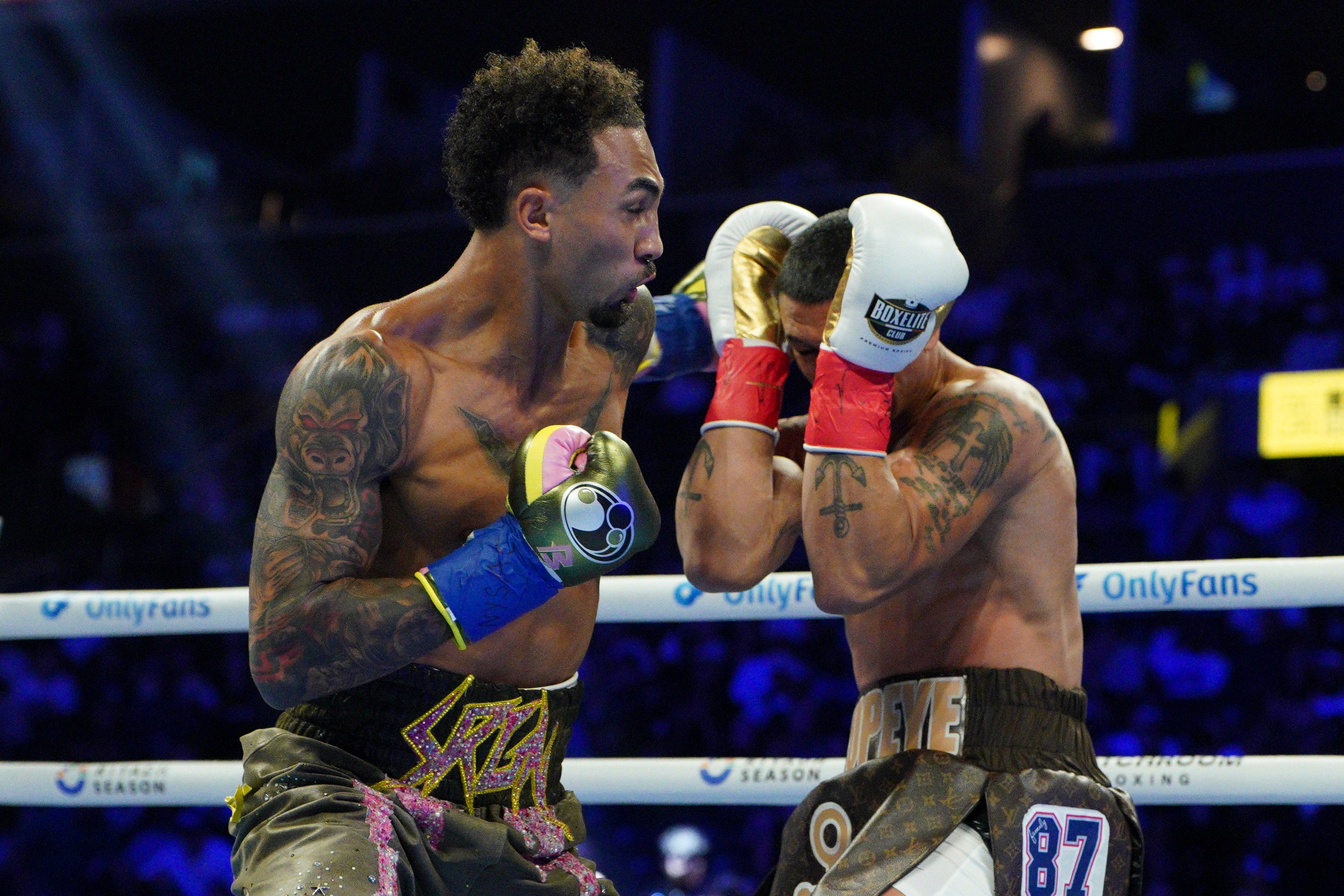 Ben Whittaker (L) throws a punch at Richard Rivera on the Xander Zayas v Jaron 'Boots' Ennis undercard