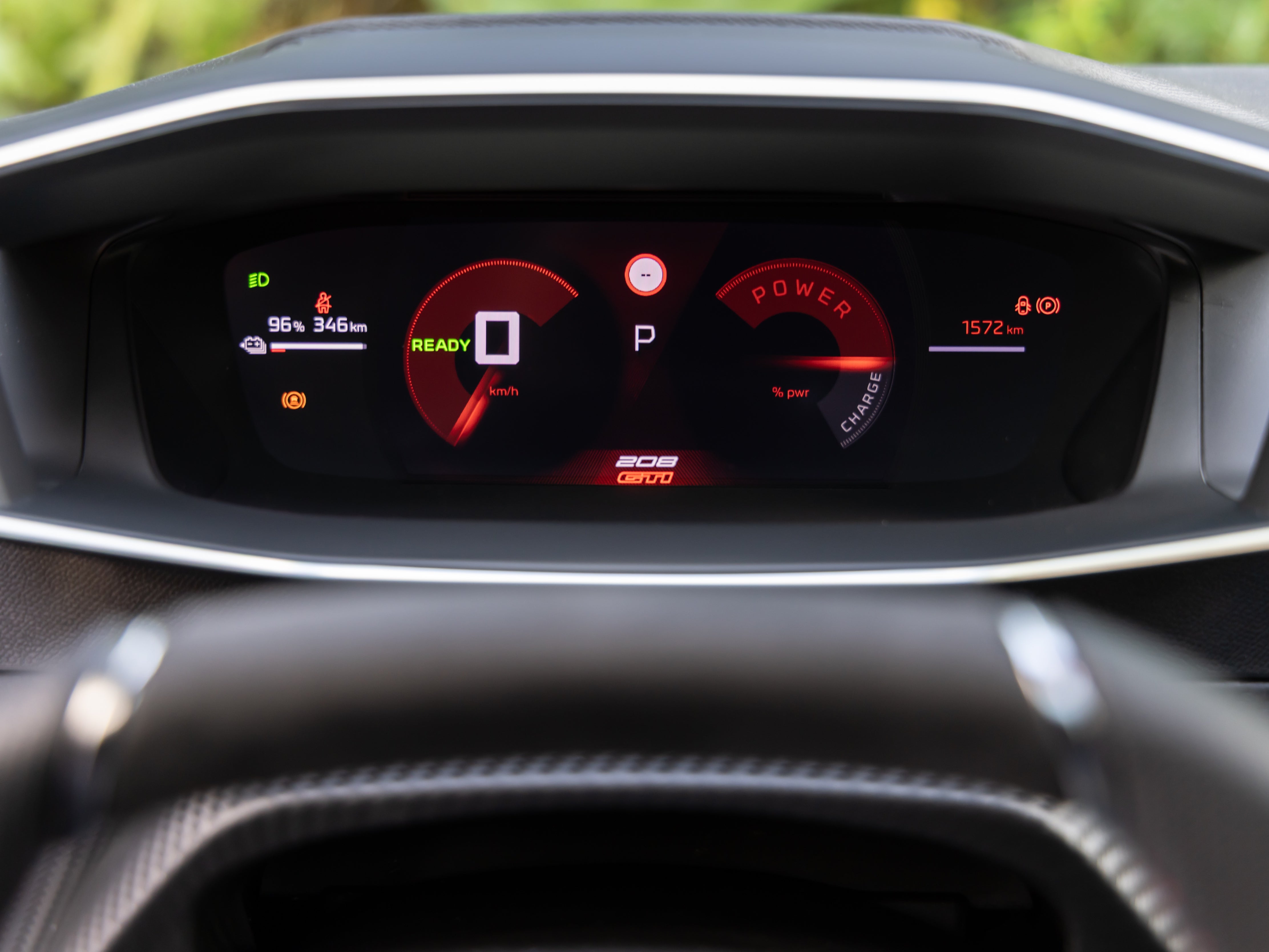 There are signs of the 208's age inside the E-208 GTi, including the iCockpit which means you have to set the steering wheel low to see the instruments (Peugeot)