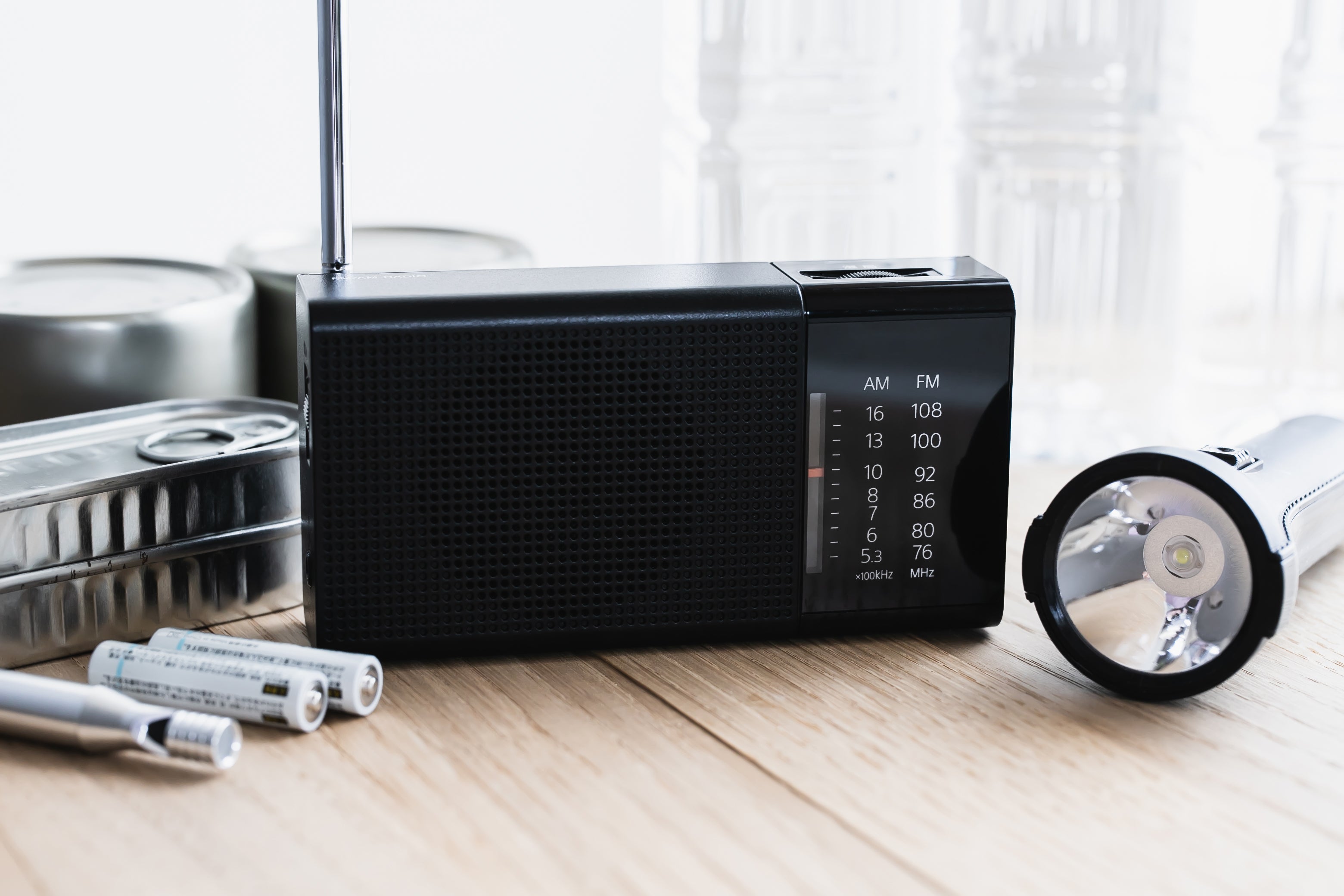 Keep some batteries, a radio, a torch and tinned food in your emergency kit at home.