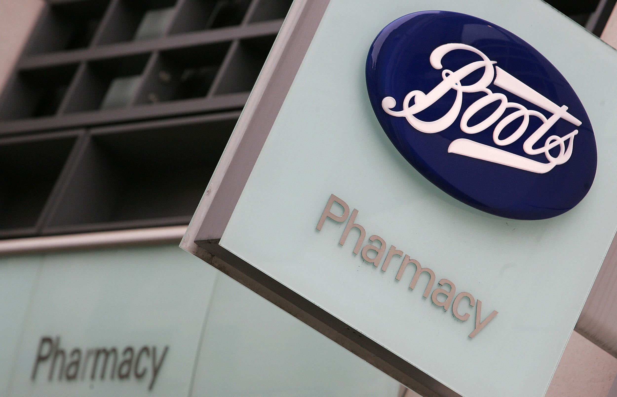 A sign is seen outside a Boots pharmacist in Fleet Street in London