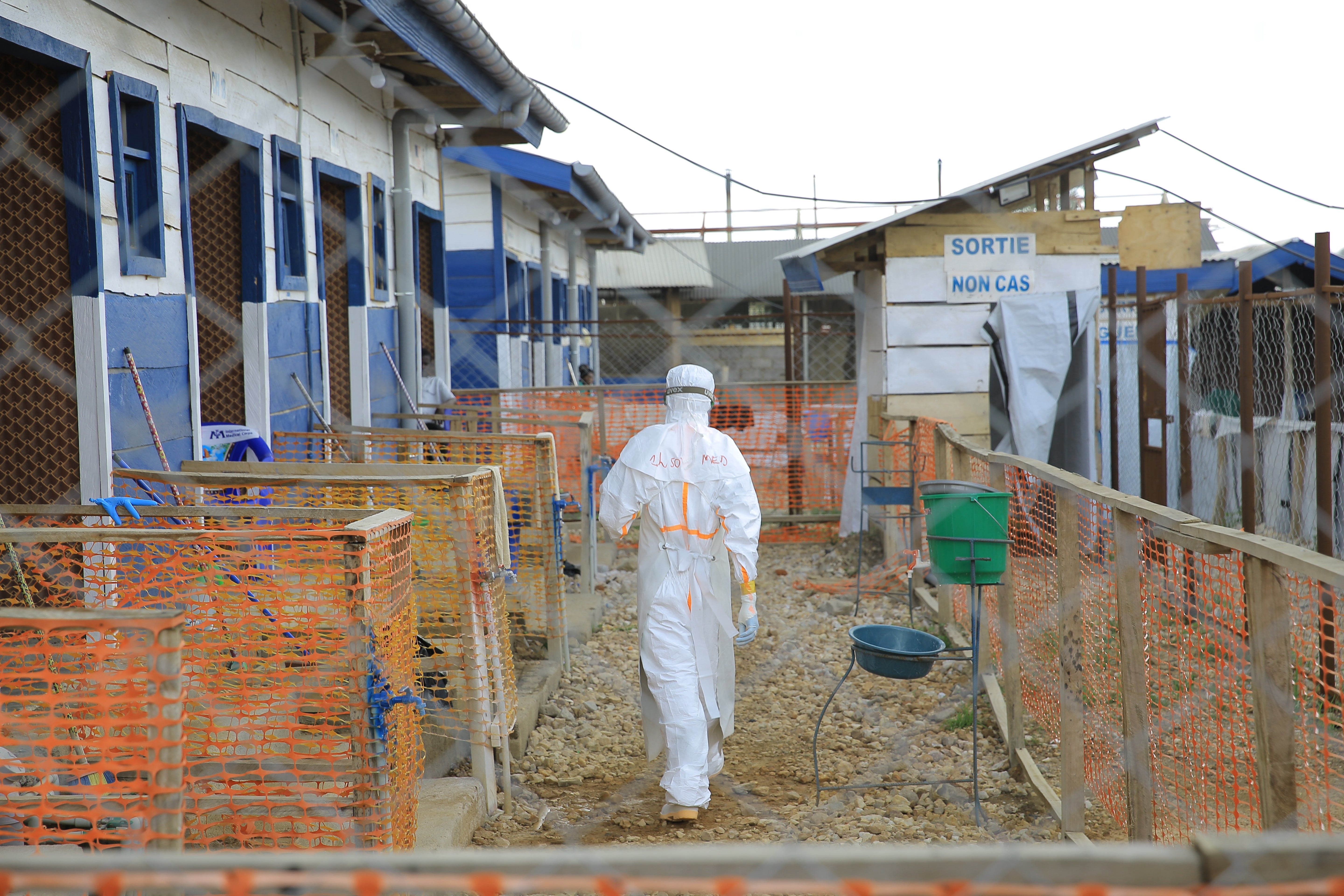 A healthcare worker walks inside a treatment center for Ebola patients in eastern Congo