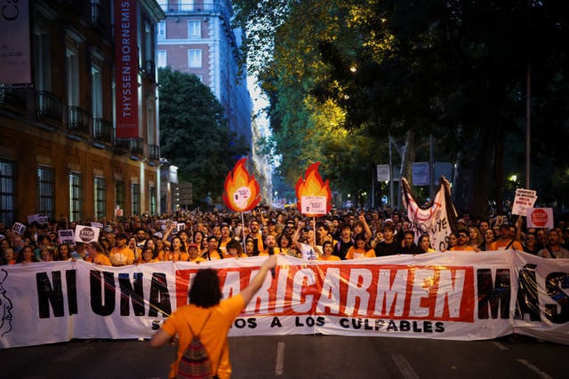Demonstrators hold a banner reading: "Not one Maricarmen more" during a protest against Spain's housing crisis