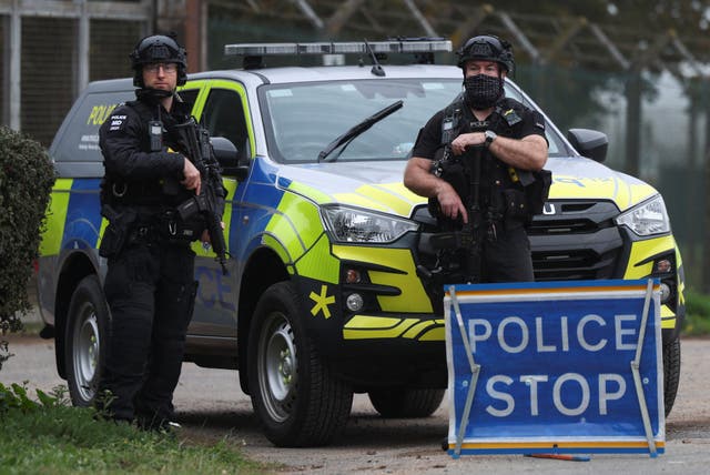 Police officers guard an area as roadblocks remain in place near RAF Fairford airbase