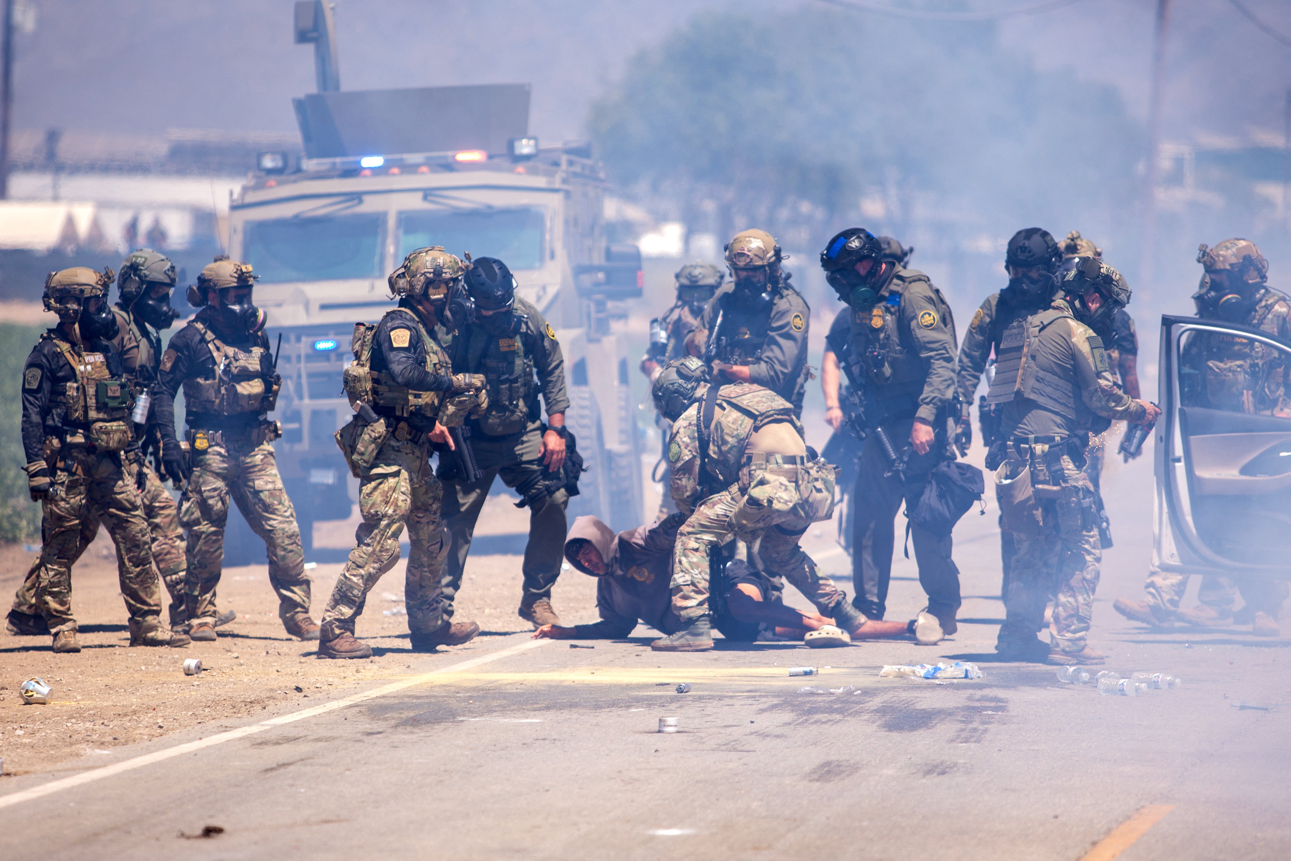 George Retes, a U.S.-born citizen and Iraq War veteran, was pictured being dragged from his car by agents in July 2025. He was brutally detained for three days after being caught up in the ICE raid at the farm where he worked as a security guard in Camarillo, Southern California (AFP via Getty Images)