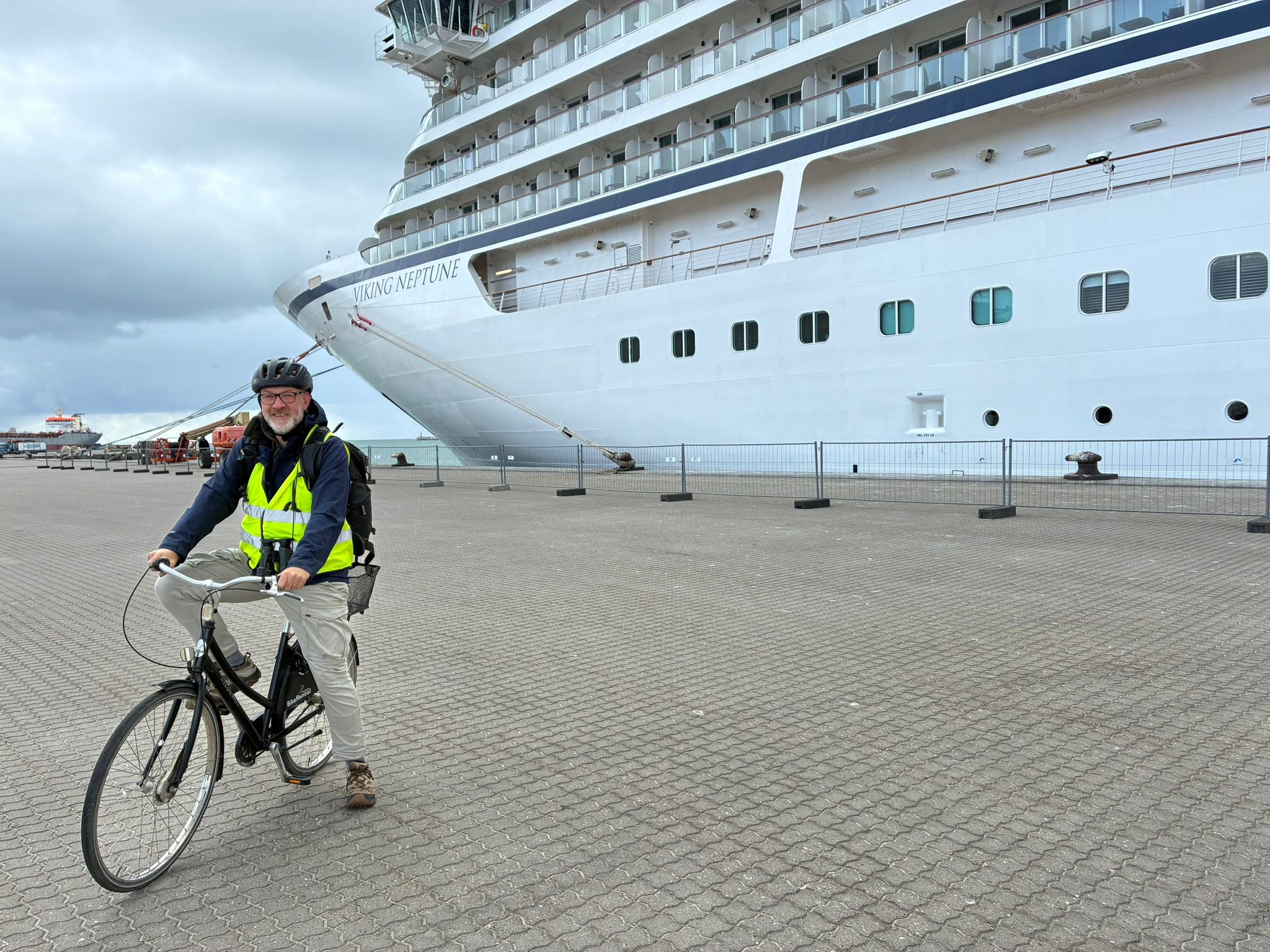 Writer Mike Unwin beside Viking Neptune cruise ship