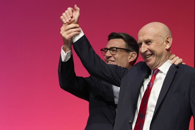 Andy Burnham with Chancellor John Healey during the Labour Party conference in Liverpool (Peter Byrne/PA)