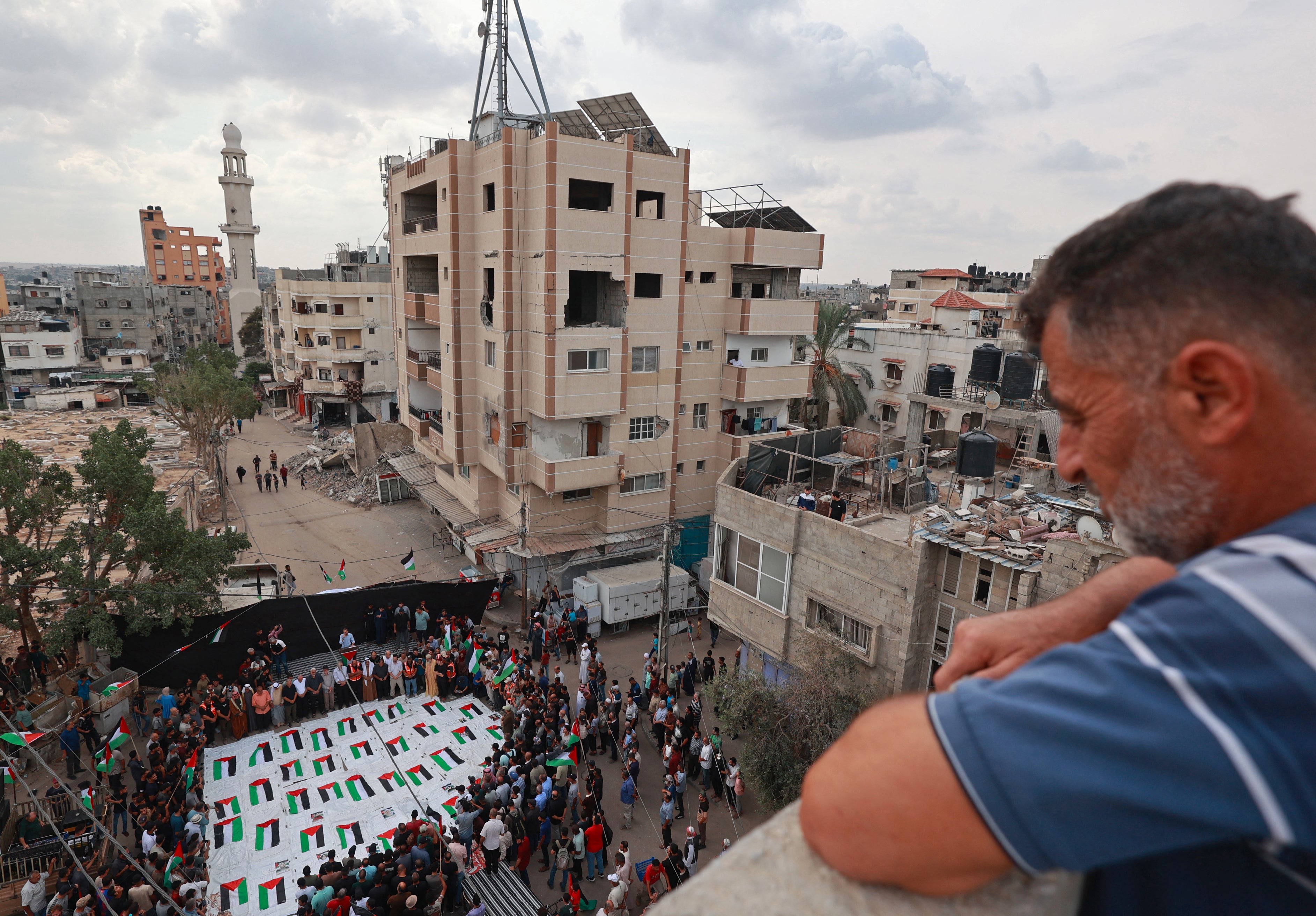 Palestinians gathered for a mass funeral at the Nuseirat refugee camp on Tuesday