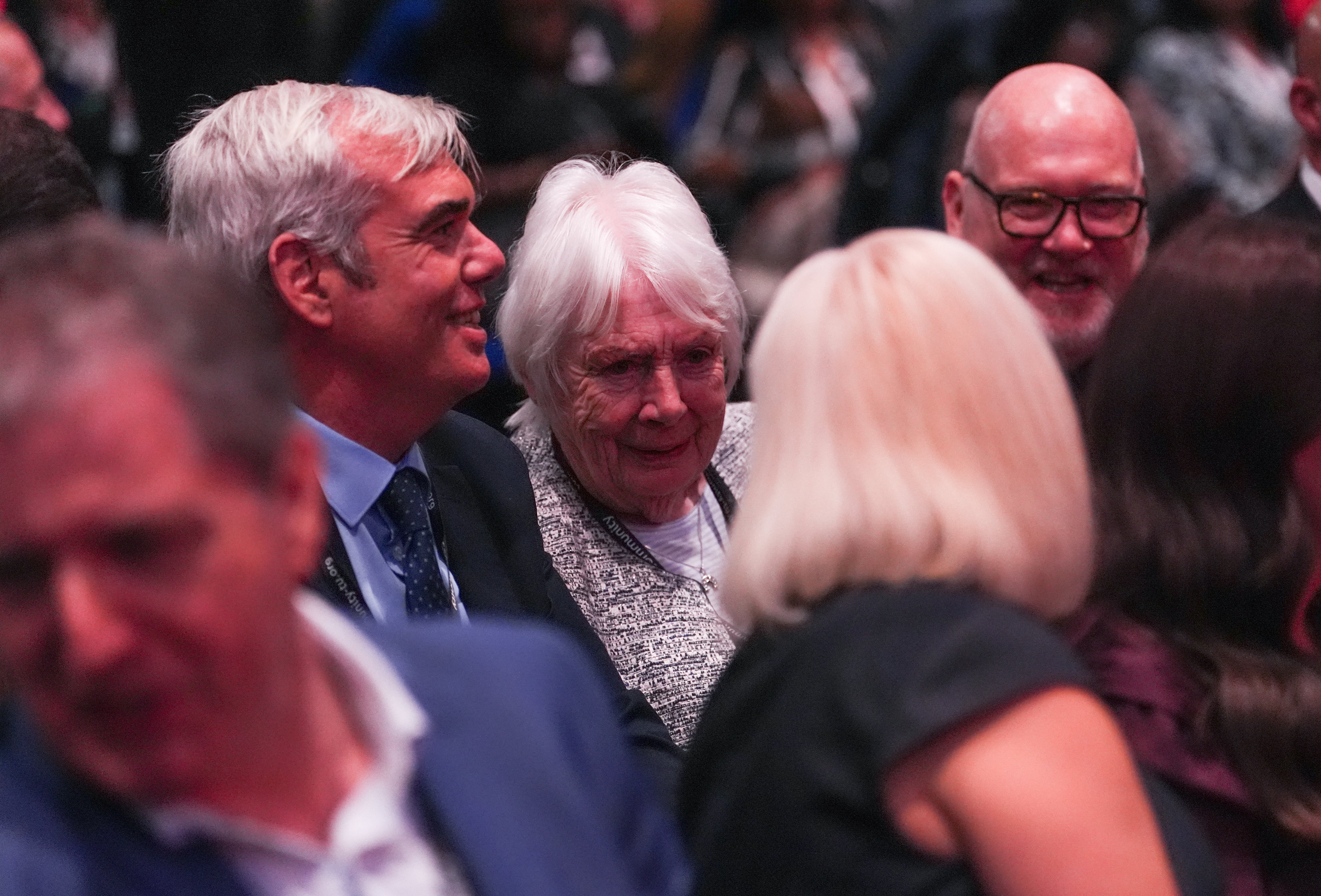 Eileen Burnham (centre) and John Burnham (left), mother and brother of Prime Minister Andy Burnham were in the audience for his first speech as Labour leader. (Annabel Lee-Ellis/PA)