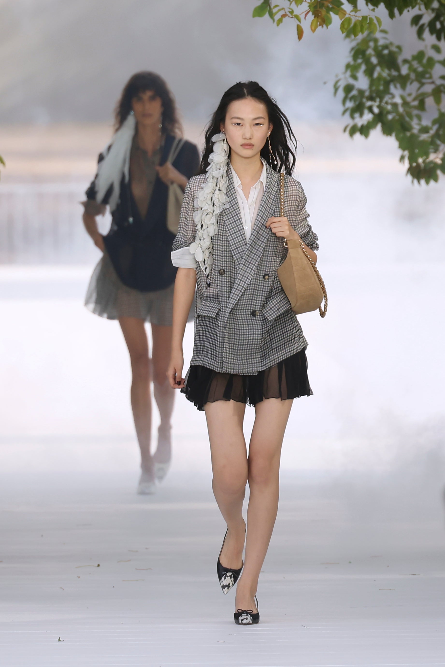 Sheer blazers over skirts were reminiscient of Dior’s 1950s silhouettes (Thomas Padilla/AP) (AP)