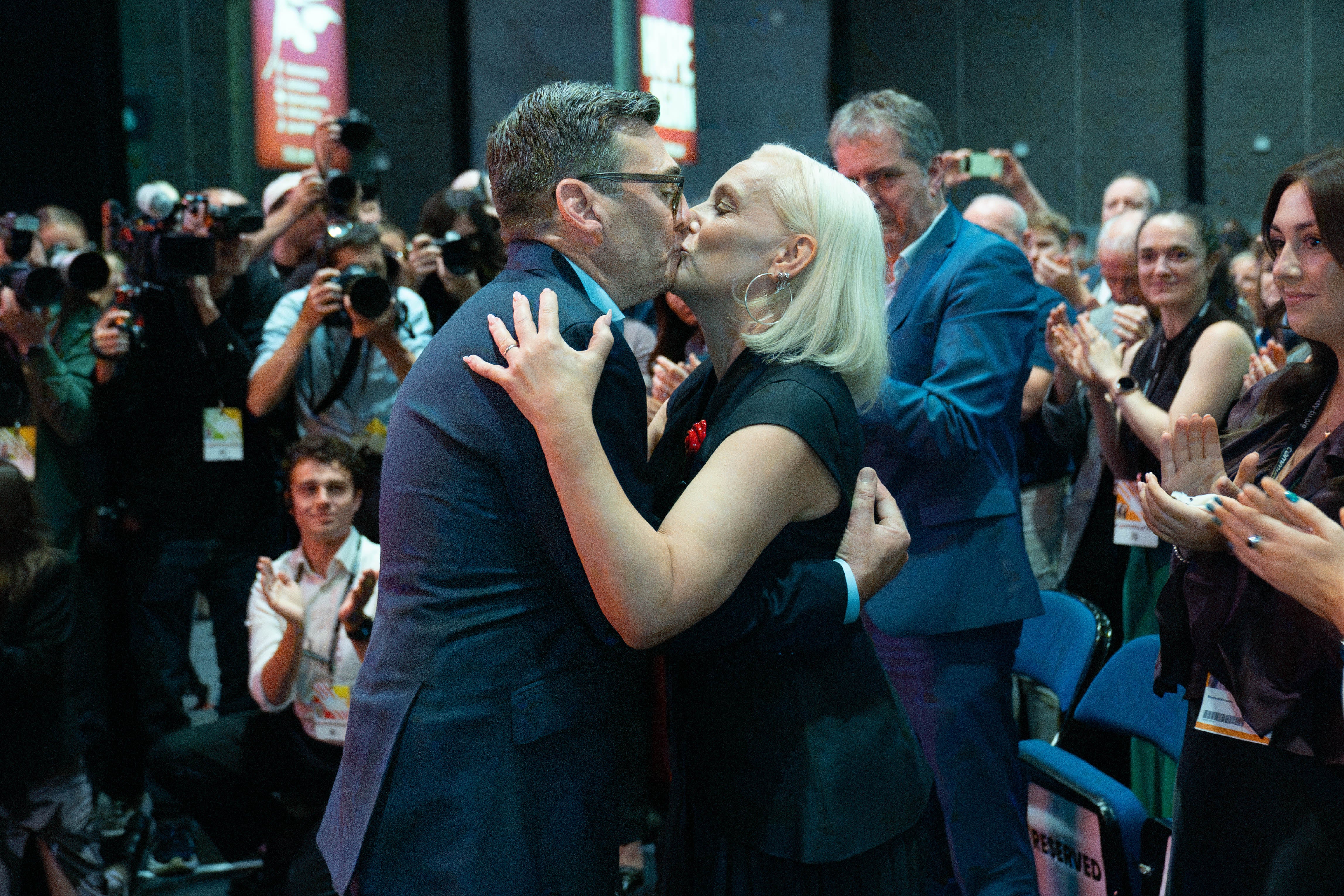 Mr Burnham embraces his wife Marie France Van Heel (AP)