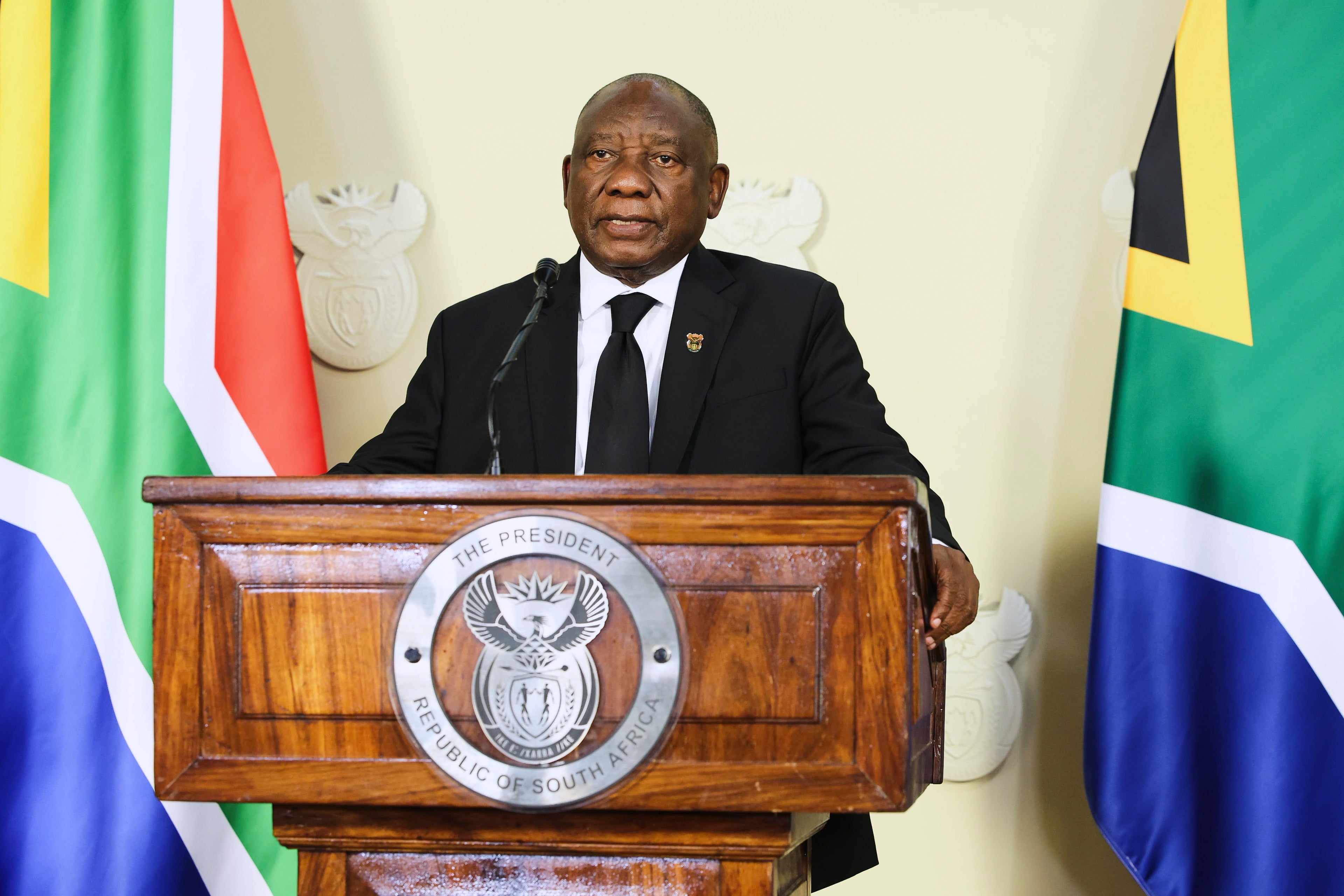 In this photo provided by the South African Government Communications and Information Services (GCIS), South African President Cyril Ramaphosa addresses the nation on new measures to tackle his country's scourge of femicide and violence against women and children as the country
