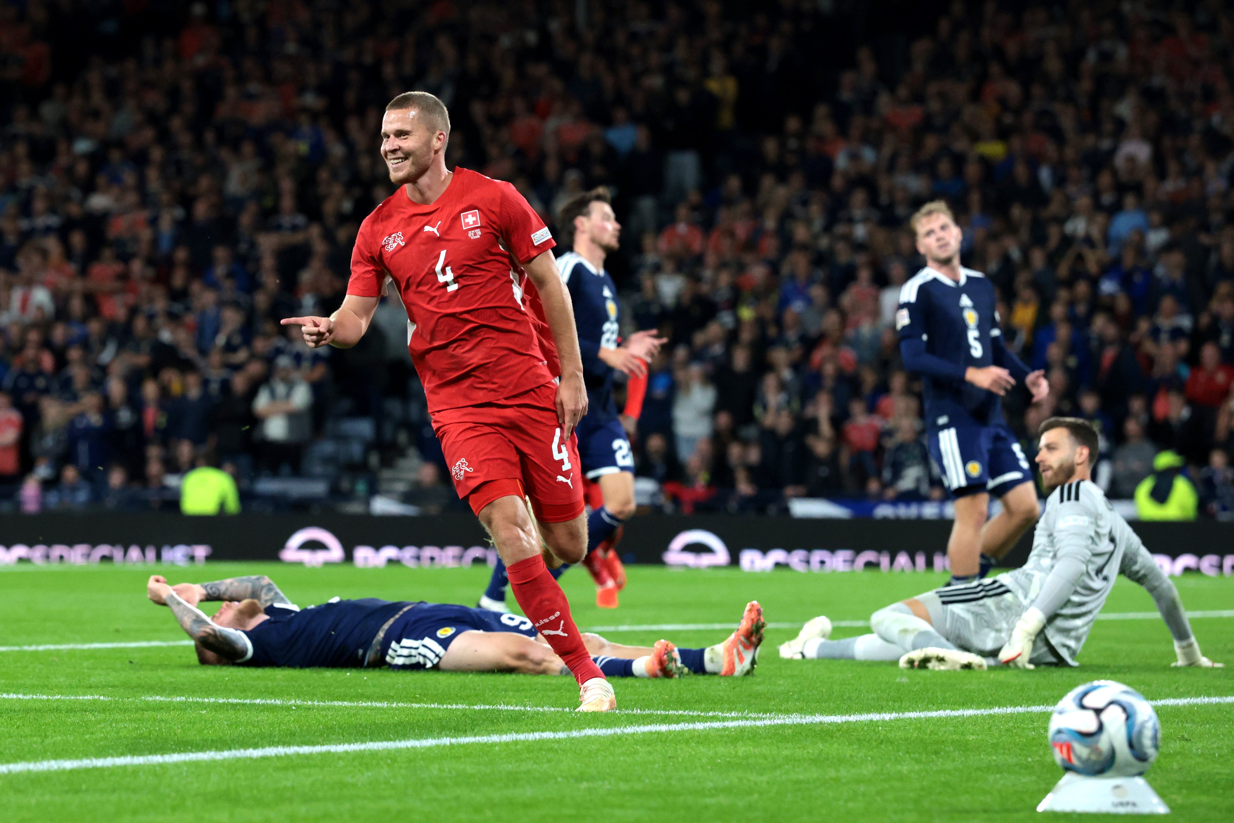 Nico Elvedi scored the second goal as the Swiss swept Scotland aside