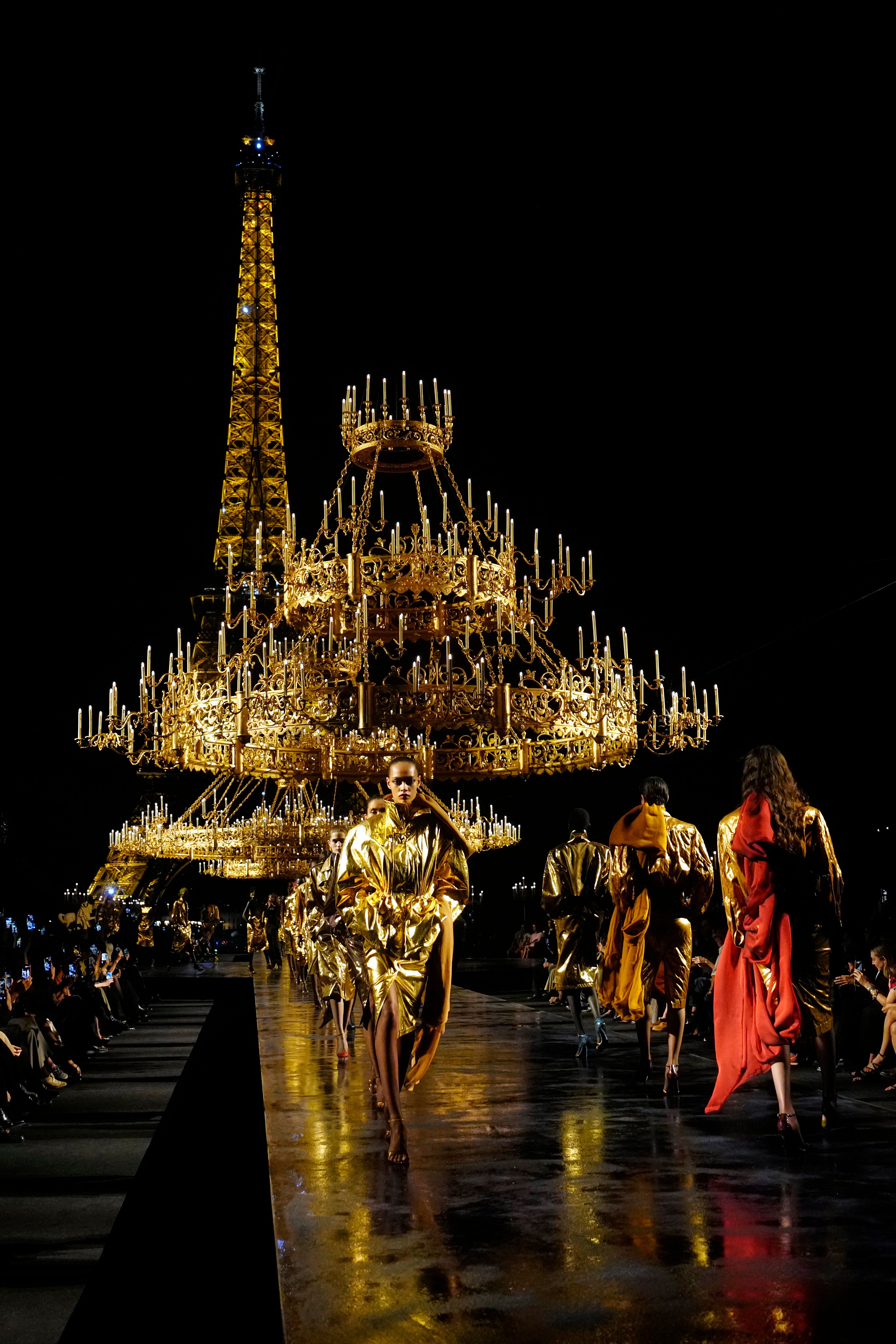 Red and ochre sheer scarves peppered the otherwise golden collection (Teresa Suarez/AP) (AP)