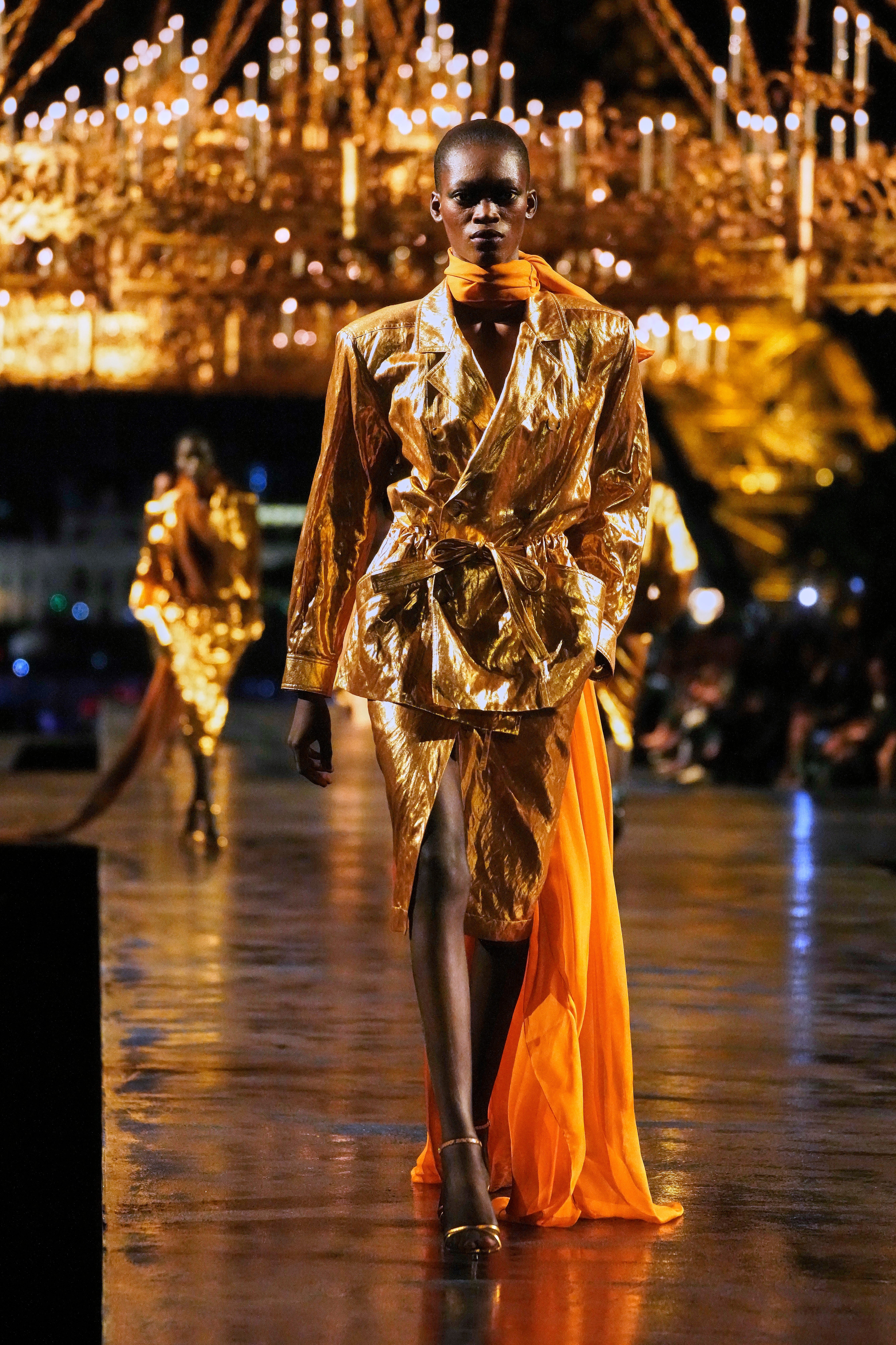 The famous Saint Laurent safari jacket of 1968 was reimagined in gold (Teresa Suarez/AP) (AP)