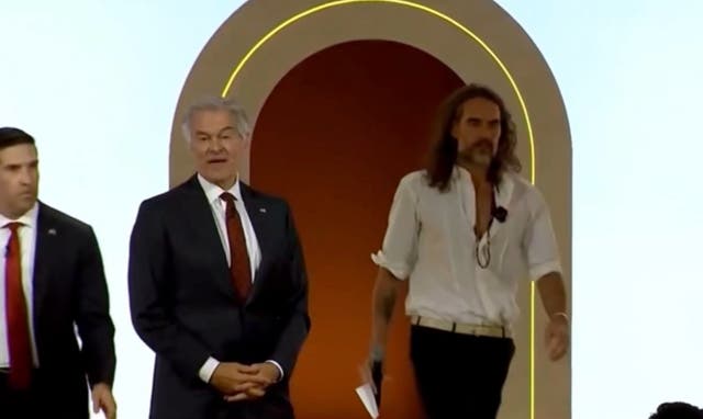 British comedian and actor Russell Brand and Dr. Mehmet Oz joked about hugging a female member of Donald Trump’s Cabinet during a panel at a summit promoting the 'Make America Healthy Again' movement
