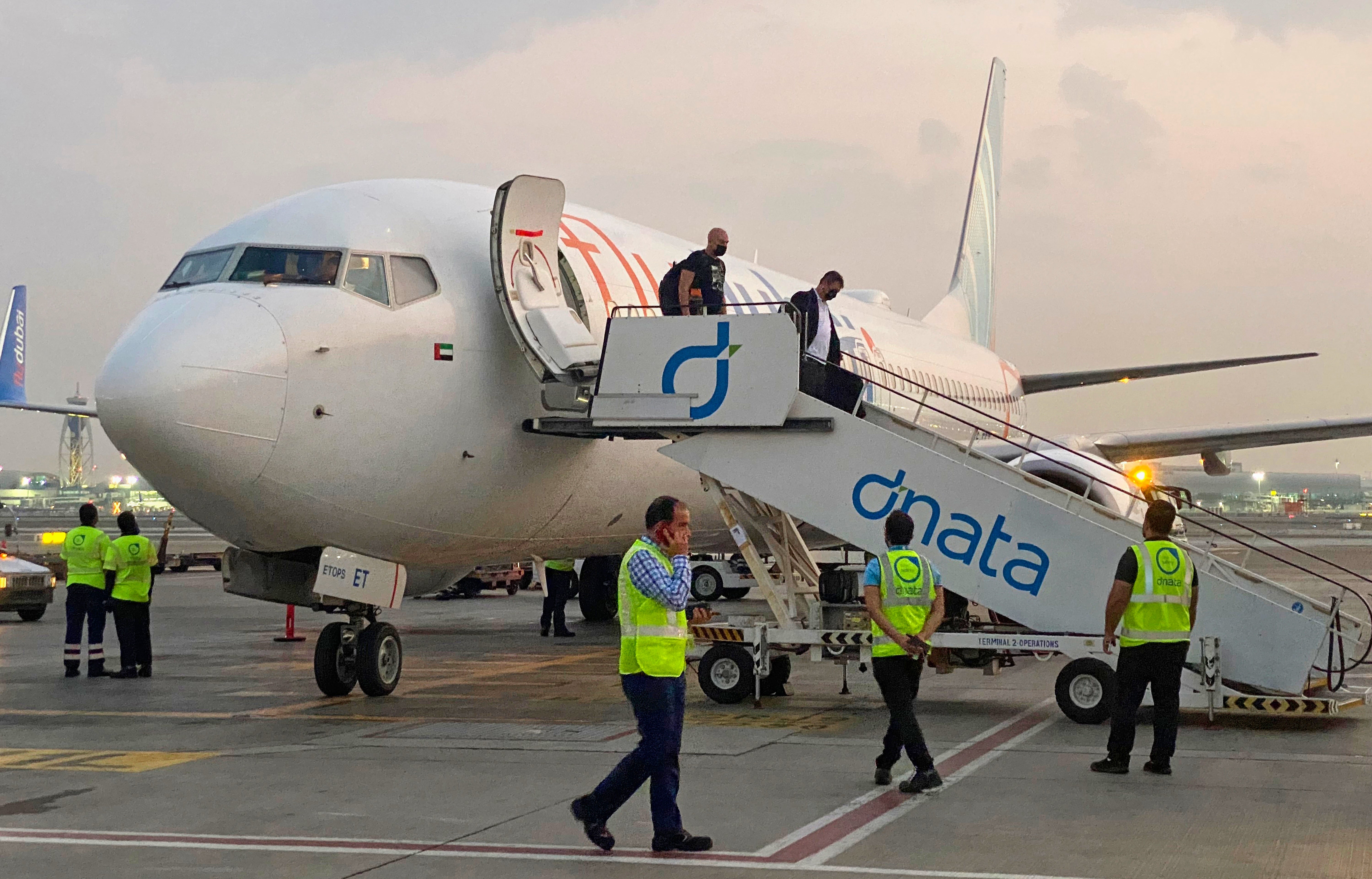 Israeli tourists leave a FlyDubai plane which departed from Ben-Gurion International Airport in Tel Aviv and landed in Dubai, United Arab Emirates, Nov. 8, 2020.