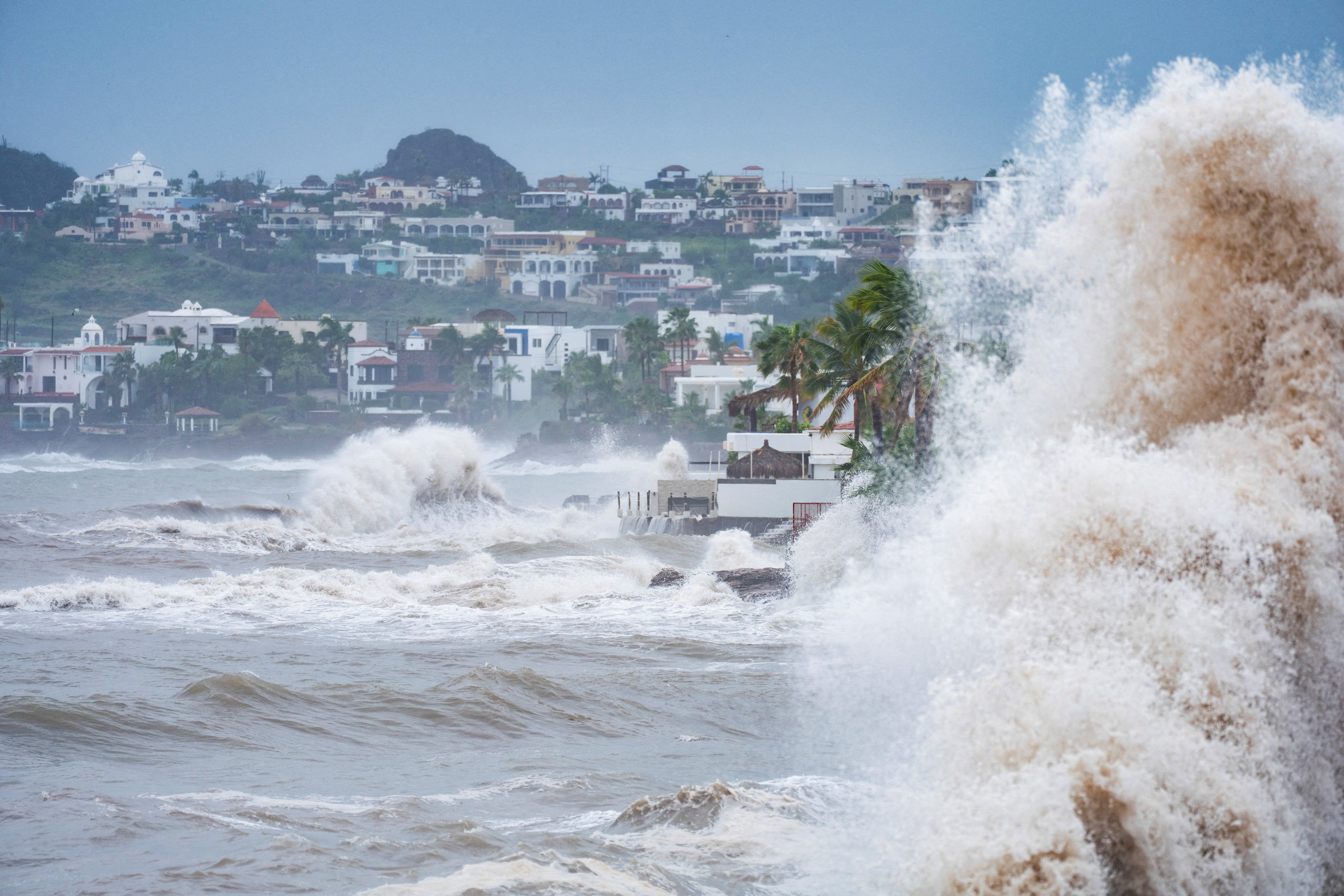 Waves crash on Manglares Beach in the aftermath of Hurricane Polo in San Carlos, Sonora state, Mexico.