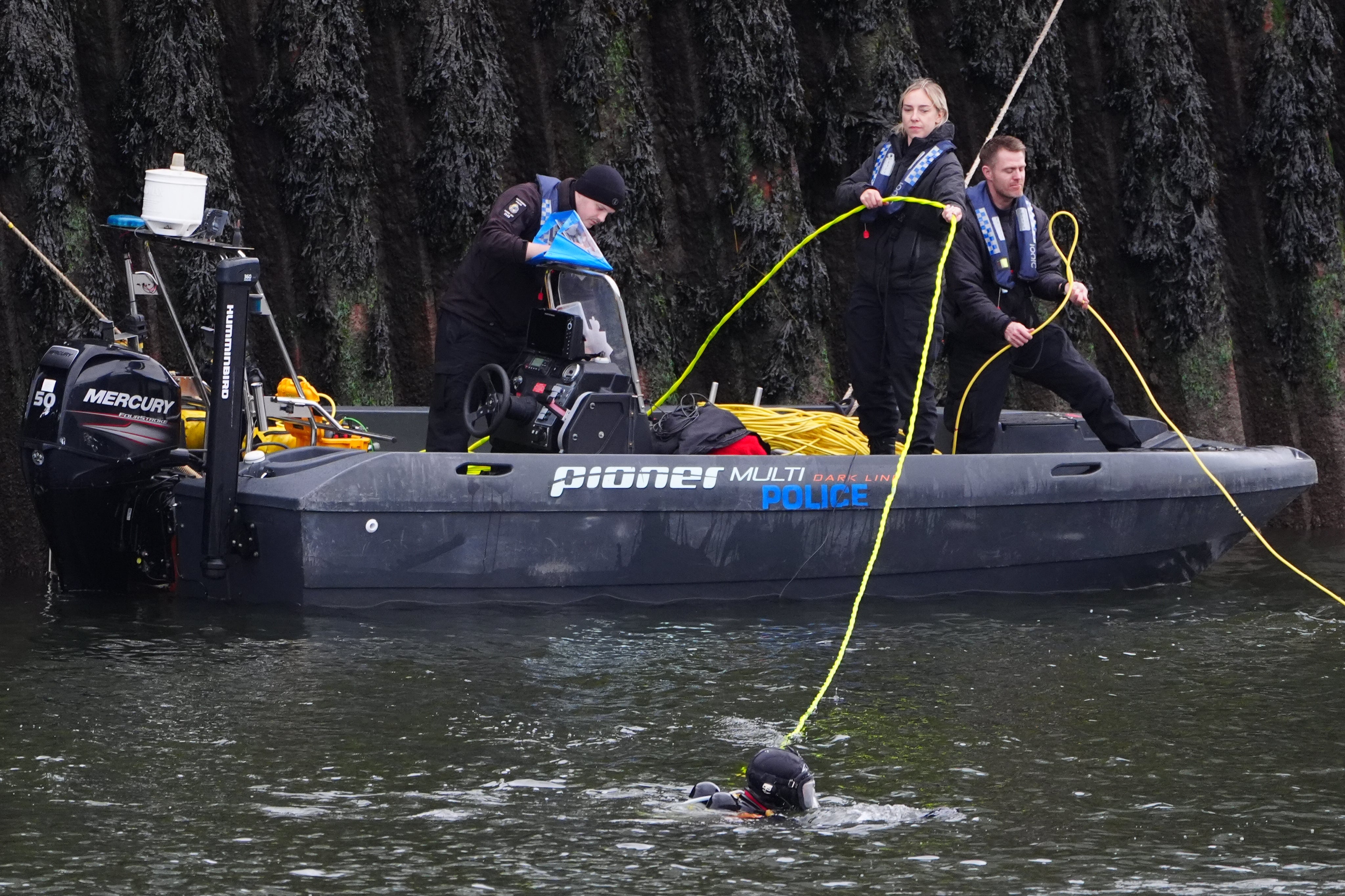 The vehicle was placed back on dry land, on its roof, just under 24 hours after it entered the river (Owen Humphreys/PA) (PA Wire)