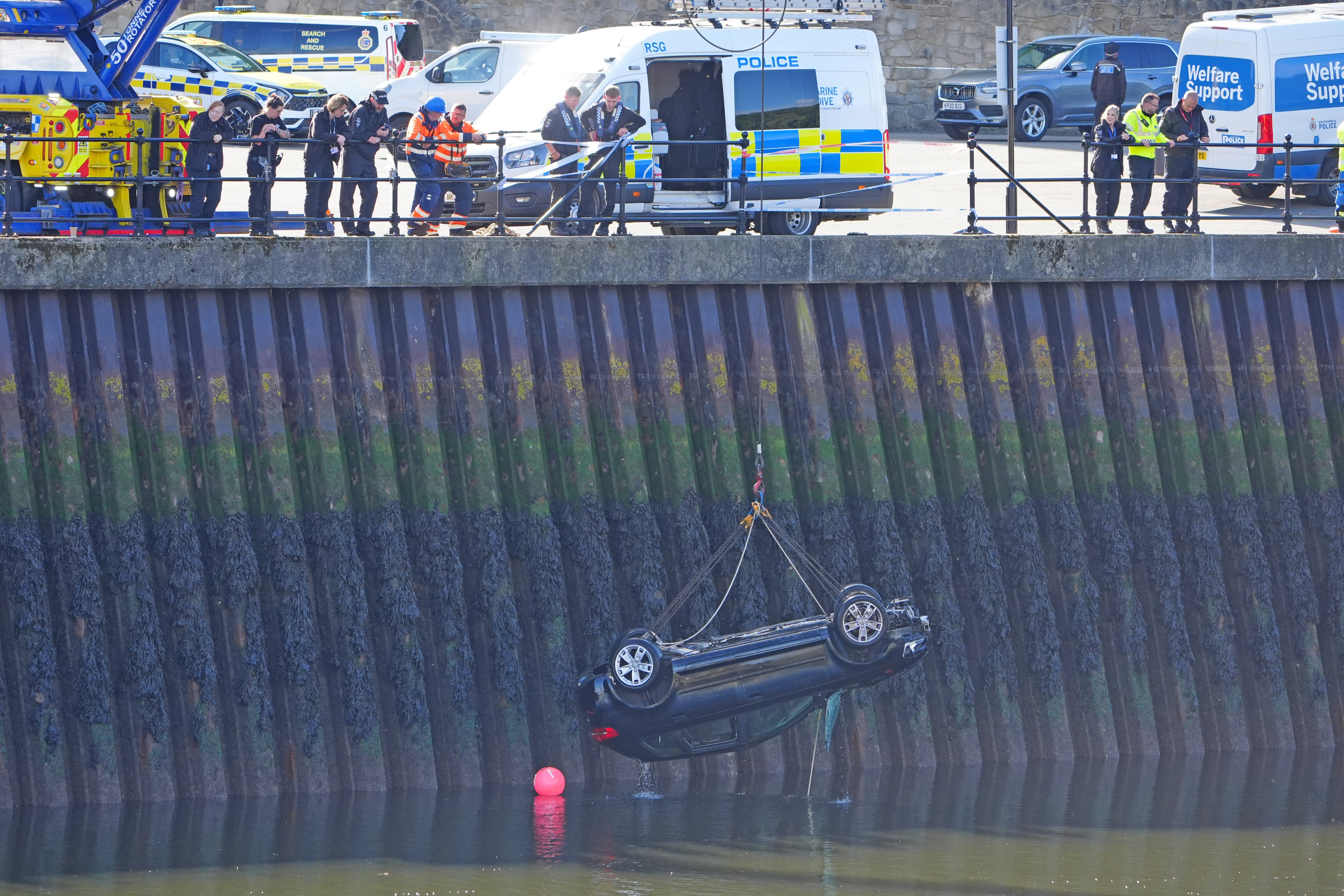 A car is removed from the River Wear in Sunderland, after three teenagers died when a car entered the water (Owen Humphreys/PA) (PA Wire)