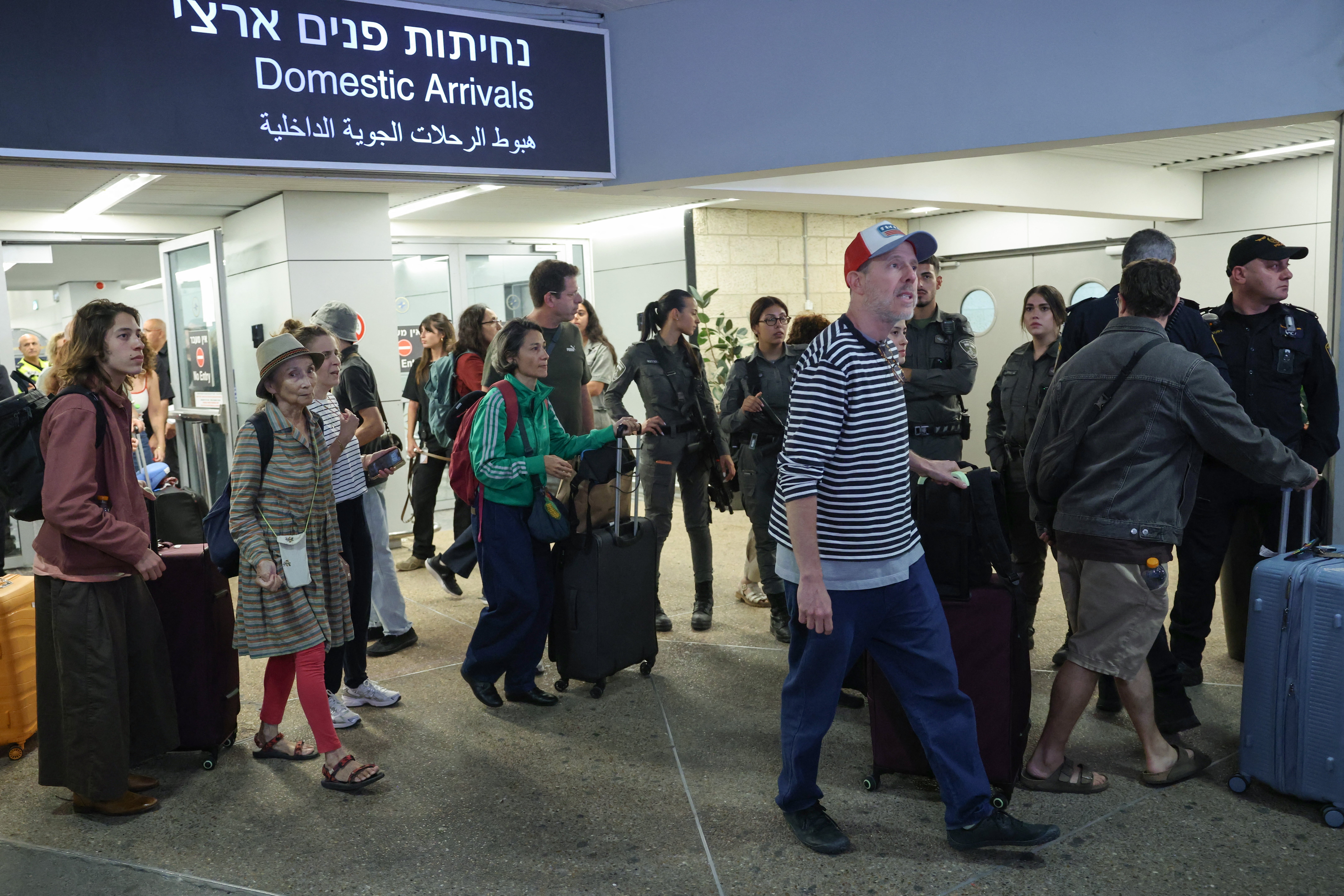 Passengers from the diverted flydubai flight arriving at Israel's Ben Gurion Airport on September 30