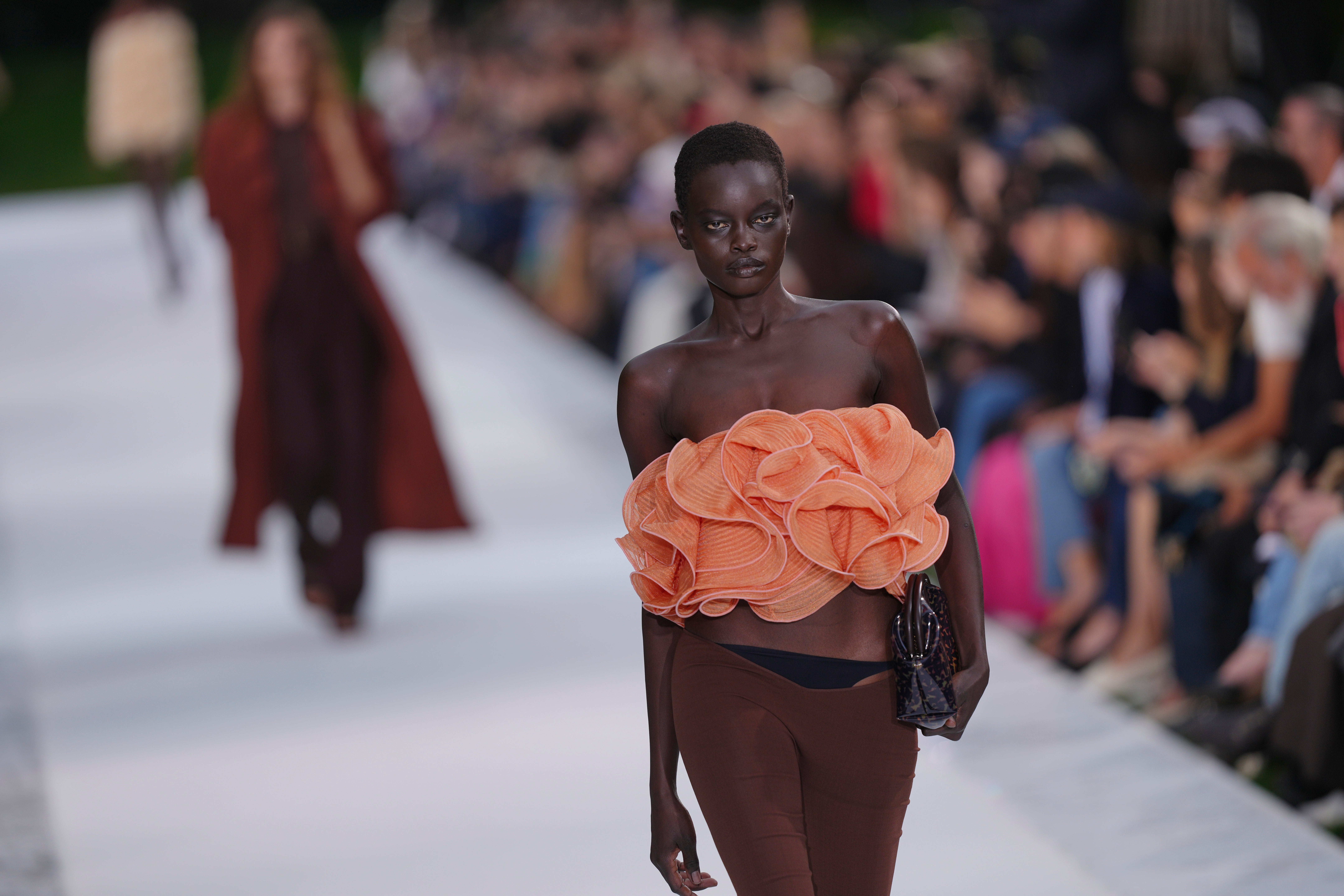 A ruffled bandeau paired with low-slung leggings exposing the model’s underwear (Aurelien Morissard/AP) (AP)