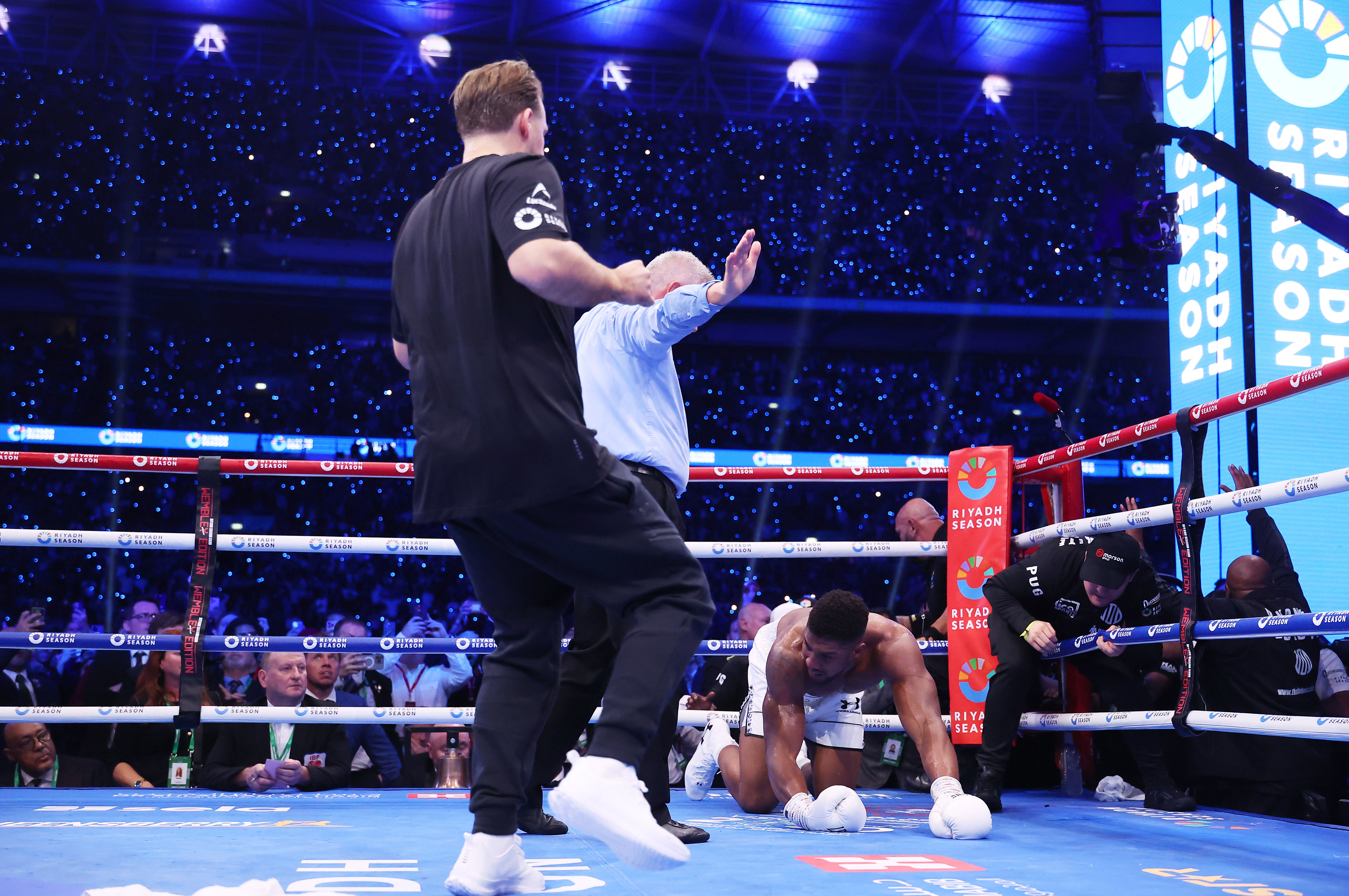 Ben Davison rushes to check on Anthony Joshua after his loss to Dubois