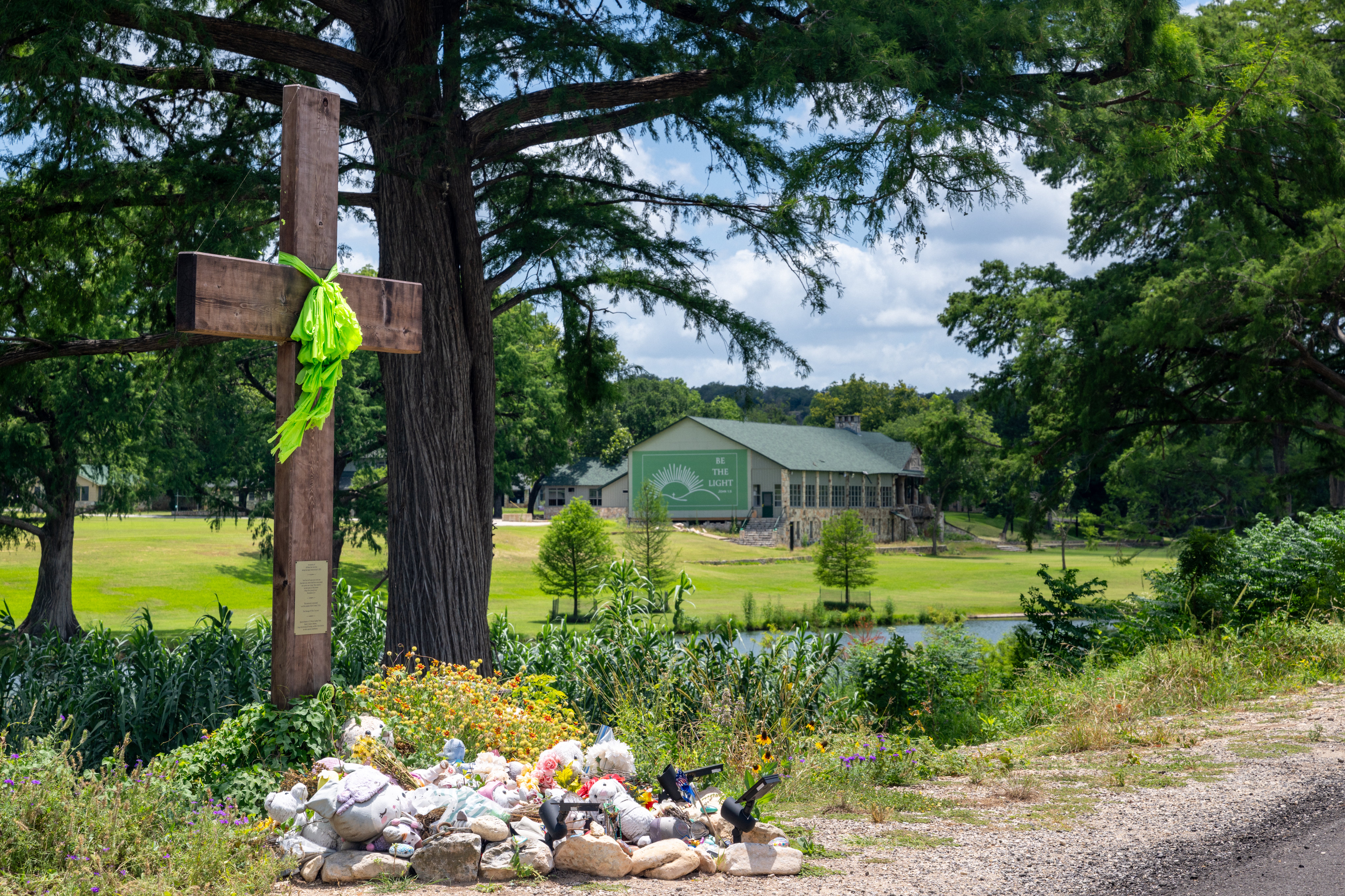 A makeshift memorial dedicated to the lives of the 25 girls and two teenage counselors who were killed during last year's Texas Hill Country flash floods is seen on June 24, 2026, in Hunt, Texas (Getty)