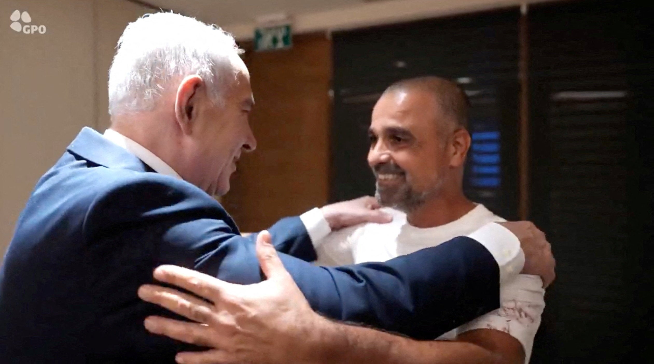 Israeli Prime Minister Benjamin Netanyahu meets Yaniv Hayun, a passenger on the FlyDubai flight bound for Israel from the United Arab Emirates, which was diverted to Saudi Arabia following an emergency signal, at the Ben Gurion Airport, Israel