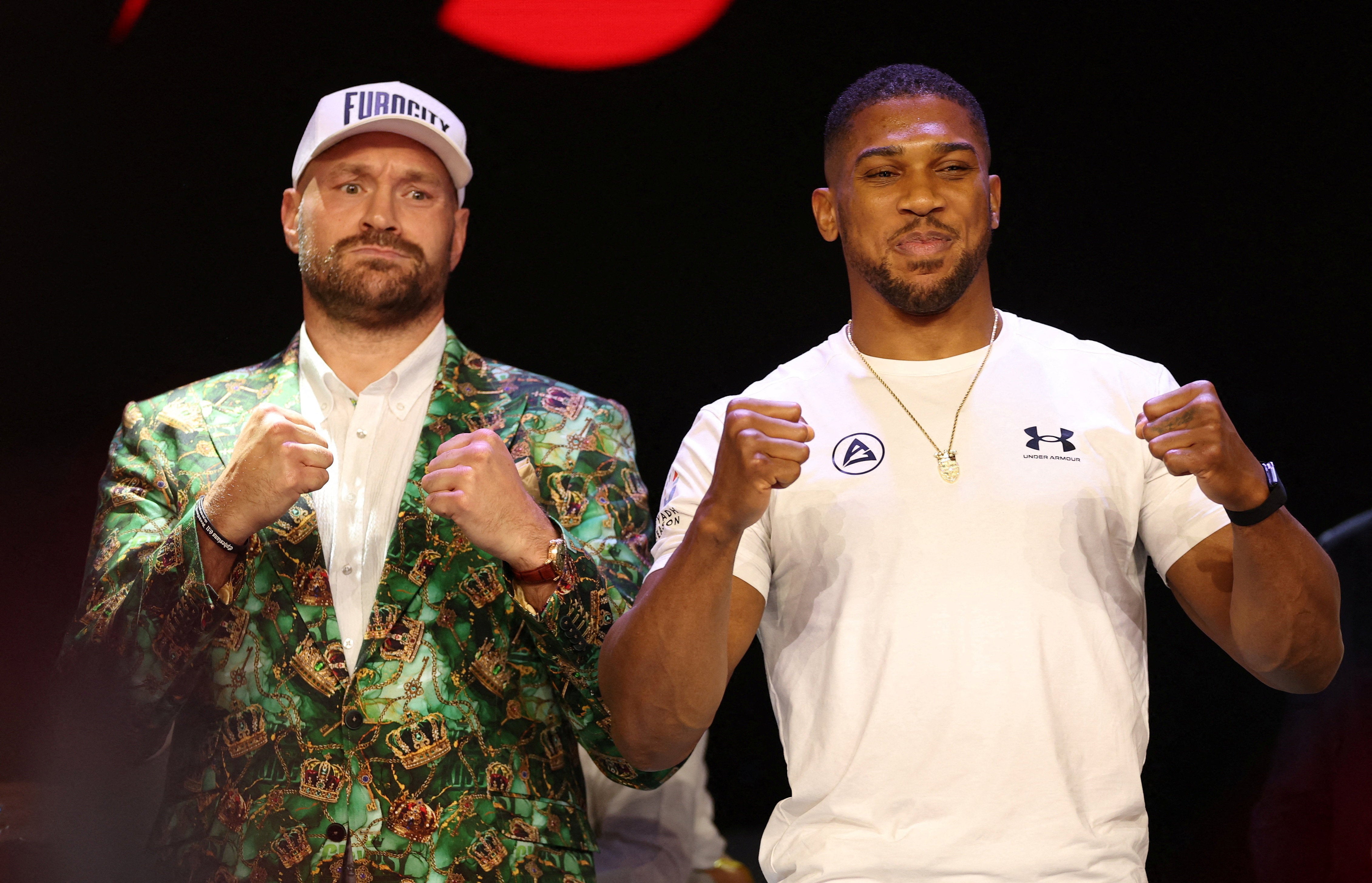 Anthony Joshua (right) and Tyson Fury pose during the press conference