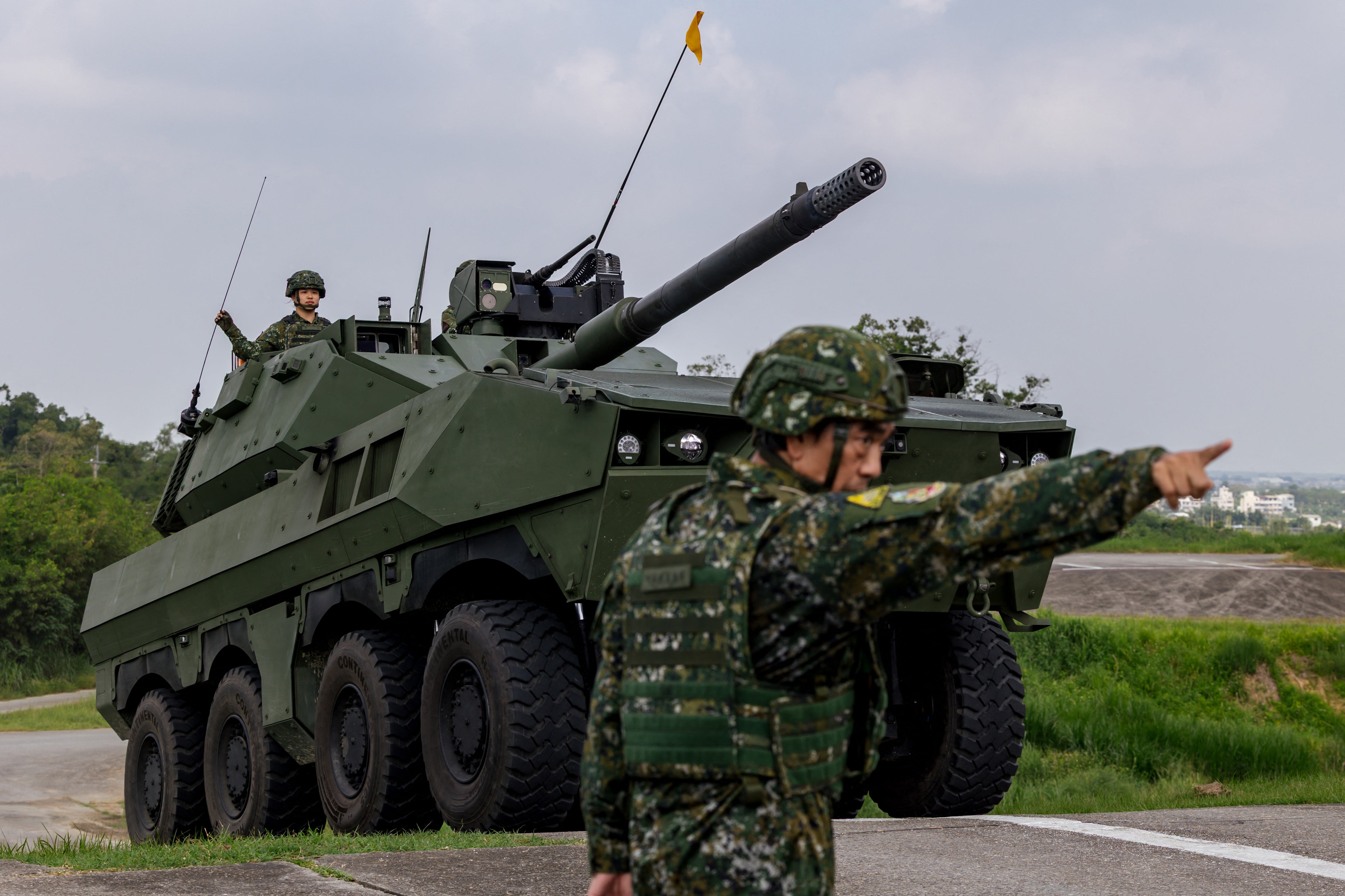 A Taiwan military 105mm wheeled armoured vehicle drives during a demonstration in Tainan on September 23, 2026
